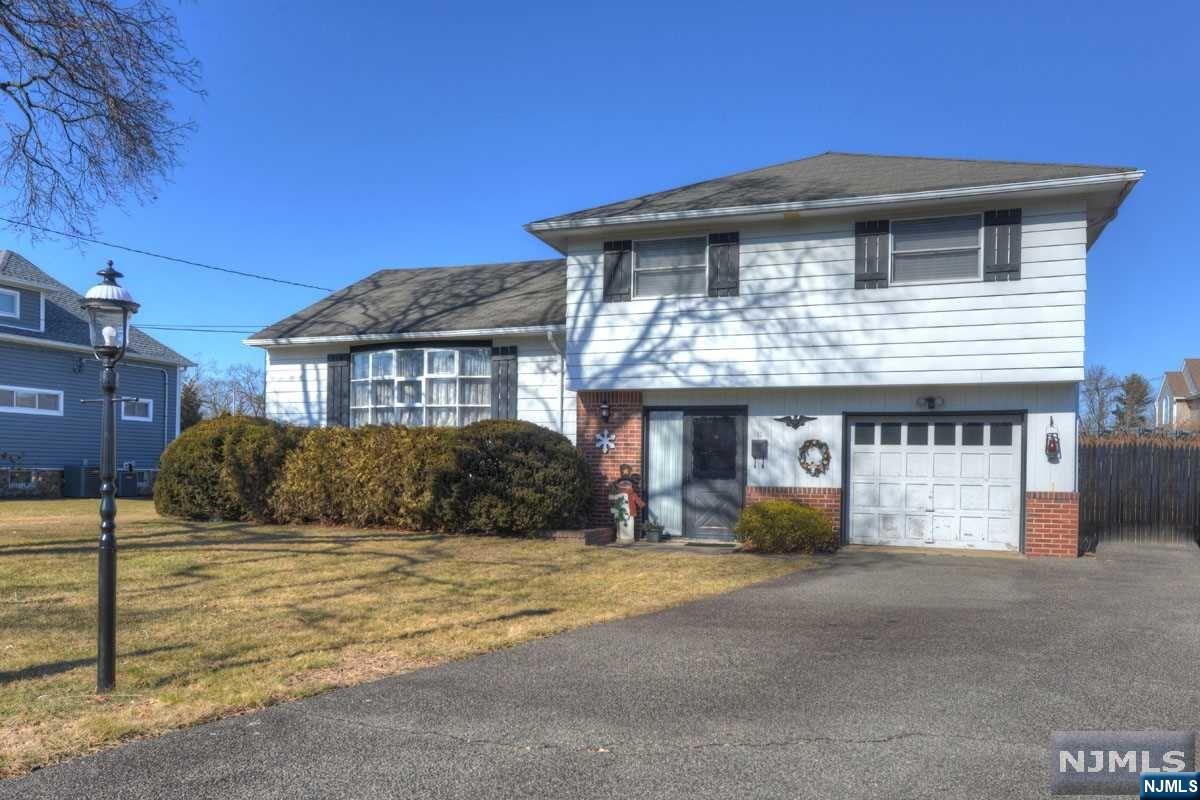 The saying goes, LOCATION, LOCATION, LOCATION! Here you go! Beautiful level 90 x 125 lot sits this 1957 Split just waiting for you to make it your own. Large Entry Foyer leads you to the Family Rm w/sliders and rear yard. Covered patio for you to enjoy all those sunny days. Garage entrance off the foyer. The Living Room offers high ceilings with REAL Wood Beams, Wall A/C. Open Dining Rm to the Kitchen. Plenty of wood cabinets and all appliances included and working. Primary Bedroom w/full bath, 2 other very nice size bedrooms. Main Bathroom with a super deep tub you'll love! Full DRY basement that's partial finished with a Rec Rm. Loads of closets for games and storage. Laundry & utility room. Plenty of parking and beautiful curb appeal. Area home sold in the $900's. Enjoy many programs for all ages with Parks & Rec, Boys & Girls Club etc. Ideal location gets you to major highways in minutes. Close to uptown for shopping, restaurants, public library and more. Make the move today!