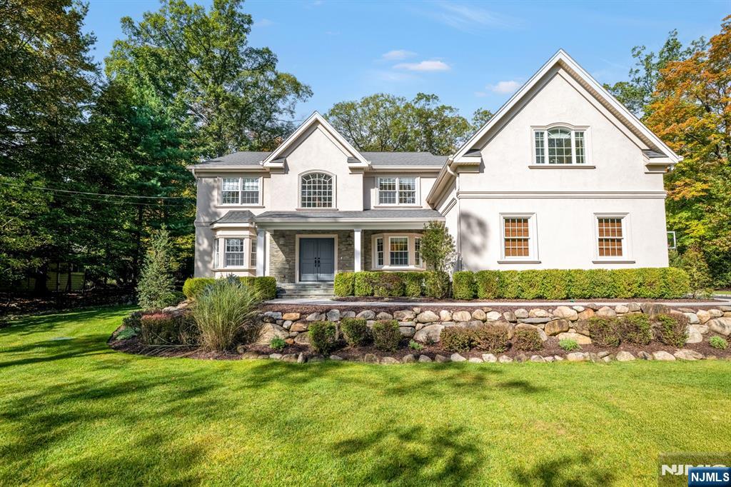Spectacular custom estate in ultra-desirable Upper Saddle River. Thoughtfully designed for luxurious living at every turn. A grand two-story entry foyer introduces formal living and dining rooms, seamlessly flowing into a spectacular two-story great room with a dramatic wall of windows, custom built-ins, and a fireplace. The open-concept layout continues into a designer chefâ€™s kitchen featuring top-of-the-line appliances, custom cabinetry, quartz countertops, an oversized center island, and a sunlit breakfast area overlooking the backyard oasis. A fully outfitted pantry, mudroom, powder room, and a first-floor en-suite bedroom complete the main level. Upstairs, the primary suite offers a true retreat with its own fireplace, dual walk-in closets, and a spa-like bath with radiant heated floors, an oversized shower, and a soaking tub. Three additional spacious bedrooms, including one en-suite, along with a full hall bath and laundry room, complete the second level. The fully finished lower level extends the living space with porcelain floors, a temperature-controlled wine room, private office, homework area, expansive recreation room with custom built-ins, gym, wet bar with dual refrigerators and dishwasher, and a custom playhouse. Designed for seamless indoor-outdoor living, the backyard is an entertainerâ€™s dream, featuring a pizza oven, built-in BBQ, heated pergola, and a large seated island. Custom window treatments and light fixtures are included in the sale.