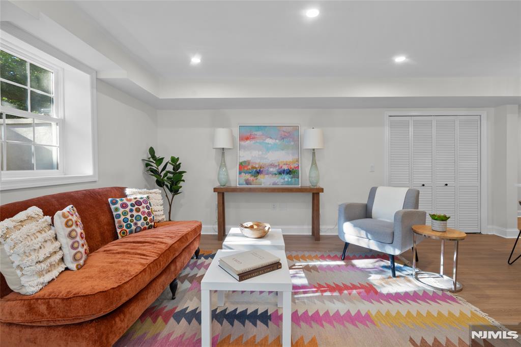 Welcome to Gateway Manor, a beautifully maintained condominium community nestled in the heart of Montclair. This fully renovated garden-level, 2-bed, 2-bath residence with garage parking offers approximately 1,100 sq feet of thoughtfully designed living space and represents a rare opportunity to own the only two-bath unit in the community. The comprehensive gut renovation showcases modern finishes throughout, incl luxury vinyl plank flooring, quartz countertops, GE stainless steel appliances, a hooded exterior-vented range, and central AC/Heat. The spacious and functional layout also features side-by-side in-unit laundry, a linen closet in each bathroom, and accessibility-focused design elements thoughtfully integrated throughout the home. A standout feature is the PRIVATE attached garage with DIRECT access into the condominium, providing exceptional convenience and security. EV charger-ready infrastructure is already installed, and an adjacent private storage unit offers additional space for seasonal and household items. THREE private entrances, including direct garage access, further enhance the home's unique appeal. Set in a quiet garden-level location within a park-like community, Gateway Manor offers the perfect blend of privacy and convenience. Residents enjoy easy access to downtown Montclair's vibrant restaurants, boutiques, cafes, parks, and public transportation options. A truly one-of-a-kind offering in one of Montclair's most desirable communities.