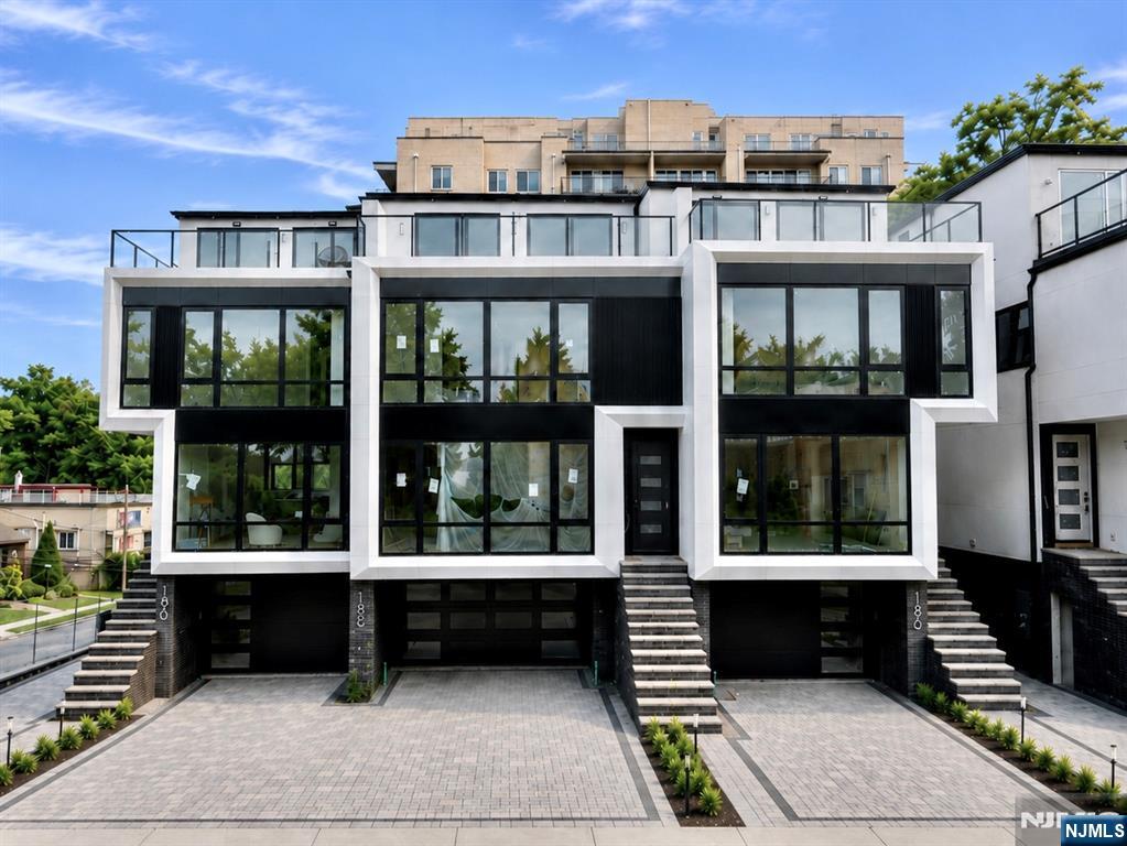Designed & Built by SILVERLINE â€” ULTRA MODERN ALUMINUM FACADE TOWNHOME. 190 Prospect - A brand-new 4BR/4.5BA townhome that offers four levels of refined luxury living just minutes from the George Washington Bridge and NYC. An architecturally striking facade with sleek metal panels and oversized European windows opens to interiors featuring wide-plank European white oak flooring, walls of glass, and recessed LED lighting throughout. The open main level is designed for entertaining with a spacious great room, linear gas fireplace, and a chefâ€™s kitchen showcasing custom European cabinetry, Fisher & Paykel appliances, a pot filler, and a Taj Mahal Quartz Waterfall Island. The primary suite offers a spa-inspired retreat with a freestanding soaking tub, frameless rainfall shower, heated floors, dual vanity, and large-format tile, while additional bedrooms feature private en-suite baths. The top level includes a private bedroom, office, full bath, and recreation room with wet bar that opens to a private rooftop terrace with glass railings. Additional highlights include spray-foam insulation, smart-home wiring, security cameras, and a prime location near Coytesville Park, Fort Lee High School, NJ Transit, and major highways.