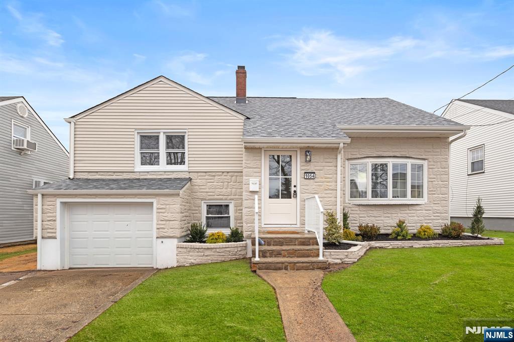 Totally renovated 4BR/1.5BTH split level home in prime location near NYC bus, schools, parks, town pool and recreation center. Modern kitchen w/ SS appliances, new cabinets and quartz countertops overlooking the dining room with a nice, open floor plan. Brand new full bath and 3 nice sized bedrooms upstairs. Gleaming hardwood floors throughout. Step down to the ground level to find a 4th bedroom/office and 1/2 bath. All major capital improvements done so you can rest easy - brand new HVAC system (central AC/forced hot air), brand new roof and all new windows. Rough plumbing in place for an additional full bath in the top floor bedroom. For a private showing please call/text Michael 201-240-8422.