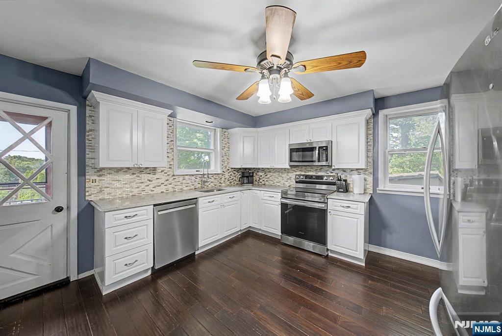 Welcome to this beautifully updated Colonial, ideally situated on a quiet dead end street in the highly desirable Lake Telemark. Enjoy the charm of this welcoming lake community, where residents have the opportunity to enjoy the private lake, beaches, fishing, kayaking, community events, & a peaceful neighborhood atmosphere, all while remaining within close proximity from major highways. Inside, you'll find a bright, open concept layout designed for today's lifestyle. The beautifully renovated kitchen flows seamlessly into the dining area and features quartz countertops, stainless steel appliances, radiant heated floors, and plenty of space for gathering and entertaining. Both full baths were tastefully renovated, offering modern finishes and timeless style. Primary suite with cathedral ceilings, two additional generous sized bdrms and a versatile finished 3rd floor provides valuable bonus space that currently serves as a bdrm but could also function as a home office, playroom, guest suite, or media room. Throughout the home, you'll appreciate abundant closet space and thoughtful storage solutions. The partially finished basement offers additional flexible living space along with plenty of storage. Outside, the inviting front porch creates the perfect place to relax, while the exceptionally long driveway provides plenty of parking. The home is also equipped with a Tesla charging station. Offering modern updates, flexible living space, this home is one you won't want to miss.
