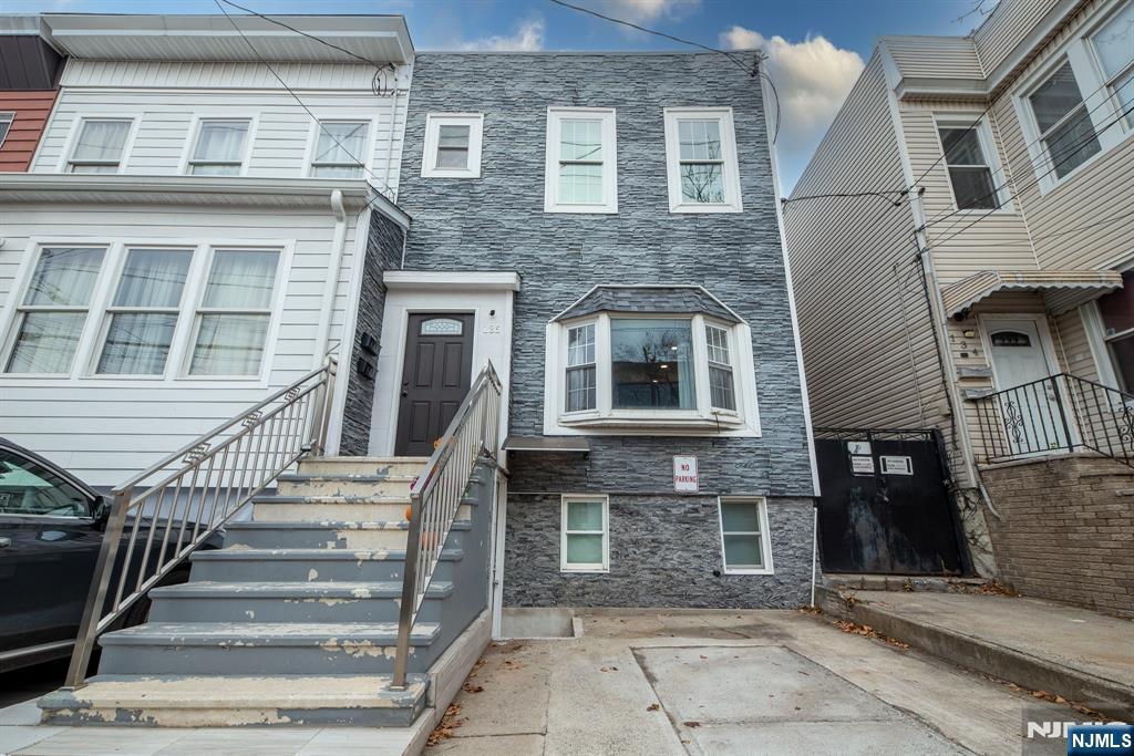 Beautifully renovated two-family home in the heart of Jersey City Heights featuring modern finishes throughout. Both units offer hardwood floors, recessed lighting, and updated kitchens with stainless steel appliances and granite countertops. The property includes four full bathrooms, a fully finished basement with kitchen and full bath, private backyard with deck and additional storage, and one-car parking. Ideally located near transportation, shopping, and dining, this turnkey home is perfect for end users or investors seeking strong income potential.