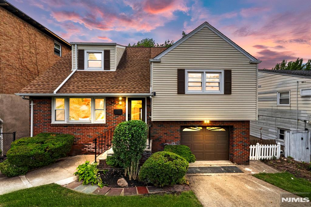 Beautifully updated and move-in ready, this exceptional home combines modern design, flexible living, and an unbeatable Palisades Park location just 5 miles from the George Washington Bridge, offering outstanding access to New York City. From the moment you step inside, sun-filled spaces, hardwood floors, and an open-concept layout create a warm, inviting atmosphere for everyday living and entertaining. The beautifully appointed kitchen features natural wood cabinetry, quartz countertops, premium finishes, and generous workspace. The spacious primary suite offers a private spa-like bathroom, while two additional bedrooms and a second beautifully updated full bath provide comfort and privacy for family and guests. The fully finished walkout lower level with high ceilings and direct backyard access offers exceptional flexibility for recreation, a home office, guests, or an in-law suite. A bright sunroom, attached garage, driveway parking, new mini-split heating and cooling systems, updated electrical and plumbing, fresh landscaping, and a spacious backyard complete this thoughtfully improved home. Just moments from Broad Avenue's restaurants, cafés, shopping, parks, and NJ Transit, you'll enjoy the perfect balance of neighborhood charm and everyday convenience. Modern finishes, versatile living spaces, and an exceptional location come together to create the perfect place to unpack, settle in, and enjoy this vibrant community.