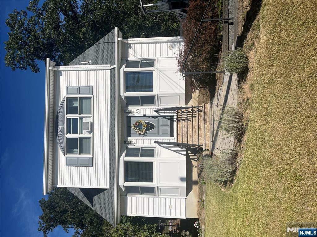 Welcome to this well loved and well cared for home located on a quiet street. The home has many updated features including a beautiful, updated kitchen with white cabinetry, wood floors in the living room and dining room, a newer 2 car garage with a walk up attic, newer retaining walls and driveway. There is much more to love here...come see today!