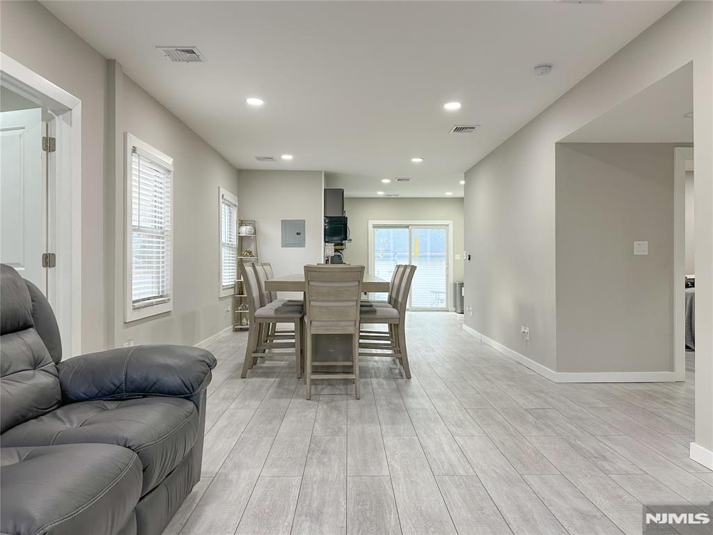 Located just 2 blocks from Roosevelt Elementary School, this recently renovated and spacious 1,200SF, 1st floor apartment, offers modern conveniences like your very own in-unit Samsung washer/dryer, central air and heating, and one parking space. This 3-bedroom 1-bath unit includes an airy open concept living room, dining room, kitchen with stainless steel appliances including refrigerator, gas range, and modern hood, a beautiful bathroom with large walk-in shower, and 3 comfortably sized bedrooms. Shared yard. One small pet may be considered. Convenient access to public transportation including a short drive to Harrison Path and NJ Transit trains and buses.