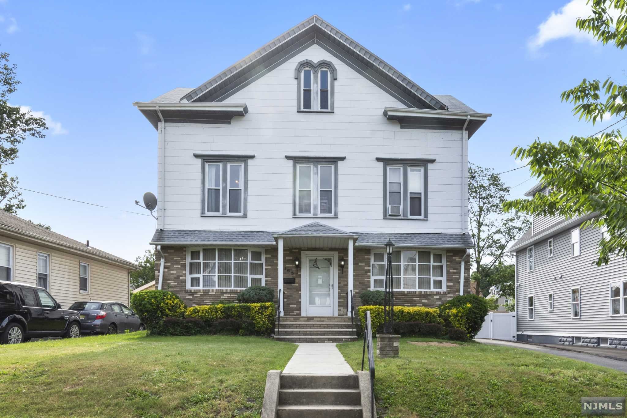 BACK ON MARKET! Welcome home to this enormous charming two family house. After being in the family for over 60 years it is finally being offered on the market! Don't miss out! Starting with the first floor apartment you're welcomed by a spacious living room/dining room combination, three large bedrooms and one bathroom. The second floor apartment features two large bedrooms, an eat-in kitchen, living room, bathroom and a bonus room perfect for an office or small 3rd bedroom. The attic is massive with high ceilings and lots of potential for additional large rooms. This unique two family home sits on a large lot offering a spacious backyard, plenty of off-street parking and five car garages that are currently bringing in additional income. This home is conveniently located near schools, restaurants, businesses and transportation to New York City.