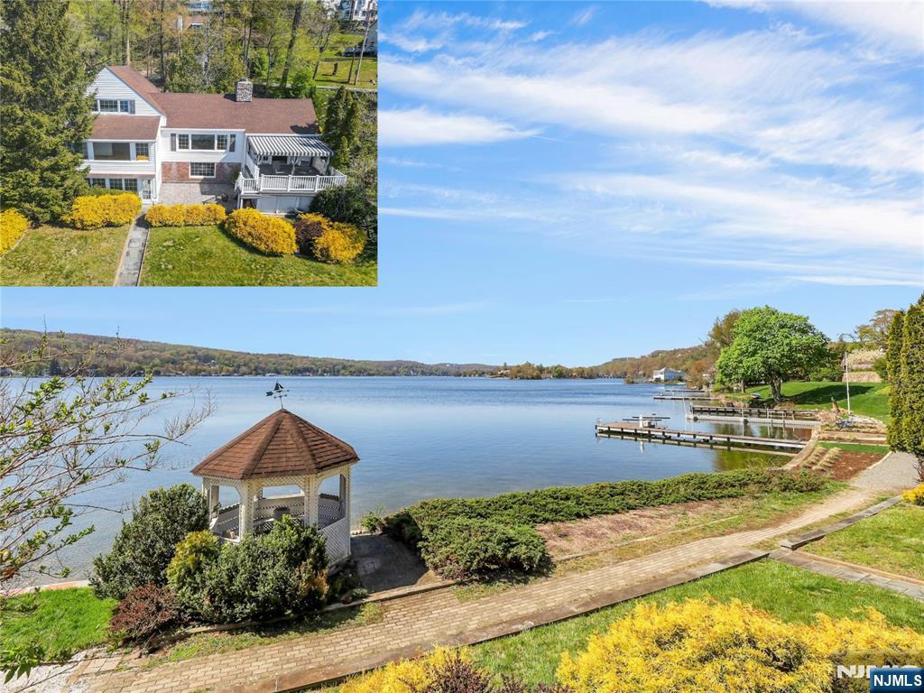 This is a rare opportunity to own one of Lake Mohawk's most coveted waterfront settings! Experience premier lakefront living in this original Crane-style home, within walking distance to the charming town in the heart of the lake community. Set on manicured grounds with breathtaking sunrises and sunsets and one of the most expansive lake views, this home showcases exceptional craftsmanship, soaring ceilings, and thoughtful design throughout. Just minutes walking distance to the highly sought-after LM Plaza, this 4BR, 3 BA residence blends comfort, elegance, and refined amenities. The main level features an open-concept living room with a wall of windows centered by a striking stone wood-burning fireplace, plus a separate sitting room. The updated kitchen with dining area opens to an expansive trex deck, perfect for entertaining or enjoying the serene lakeside setting. Add'l first-floor highlights include 2 bedrooms with a full bath. The primary suite can be on the main level or second floor, with additional bedrooms upstairs. The finished lower level offers a spacious den with a fireplace, walkout access to the level backyard, gazebo with the ability to add your own dock, a sunroom overlooking the lake, and a full bathroom. A two-car garage and abundant storage throughout complete this exceptional home. Whether a weekend retreat or full-time residence, embrace all that LM offers year-round swimming, boating, kayaking, beaches, clubhouse, tiki bar, outdoor dining, and more!