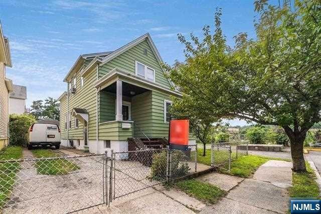 Great opportunity! Well maintained two-family on a quiet street across from park! Each Apartment has Two Bedrooms and Generous Living space! Fenced yard and two car garage! Close to shops, schools, parks and NYC transportation! Both apartments will be delivered vacant!