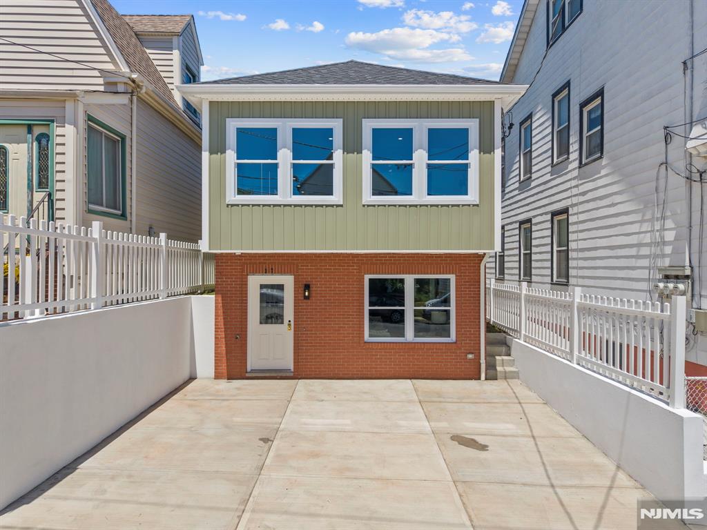 This newly built 3 bedroom, 3 bath home in Kearny offers modern design and everyday convenience. The main level features an open living area with a contemporary kitchen and abundant natural light. The bedrooms are spacious, including a comfortable primary suite with its own bath. A ground level multipurpose room provides flexible space for an office, gym, or extended guest/family area. Zoned heating and cooling ensure year-round comfort, and the property includes a two car driveway for easy parking. Centrally located in Kearny, the home offers quick access to transportation into NYC, including nearby bus routes and PATH connections, making commuting simple and reliable. This clean, modern NEW home in a commuter friendly location is truly ideal for todayâ€™s lifestyle.