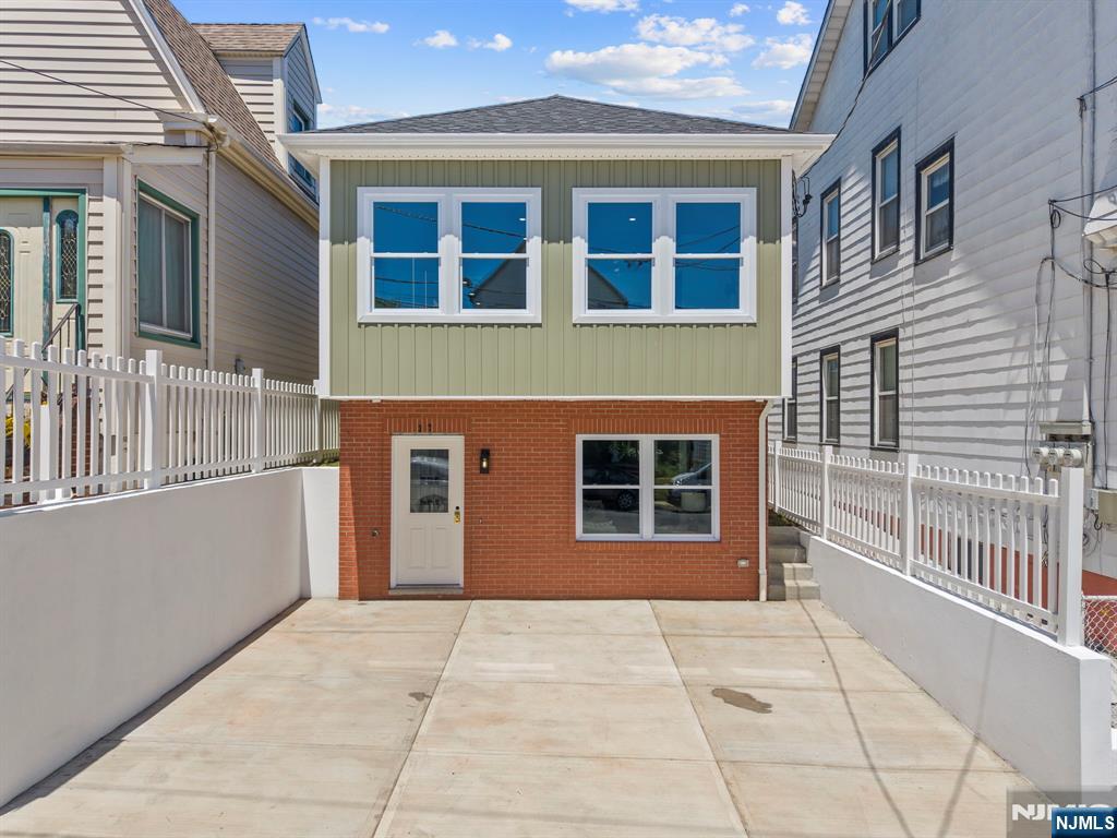 This newly built 3 bedroom, 3 bath home in Kearny offers modern design and everyday convenience. The main level features an open living area with a contemporary kitchen and abundant natural light. The bedrooms are spacious, including a comfortable primary suite with its own bath. A ground level multipurpose room provides flexible space for an office, gym, or extended guest/family area. Zoned heating and cooling ensure year-round comfort, and the property includes a two car driveway for easy parking. Centrally located in Kearny, the home offers quick access to transportation into NYC, including nearby bus routes and PATH connections, making commuting simple and reliable. This clean, modern NEW home in a commuter friendly location is truly ideal for todayâ€™s lifestyle.
