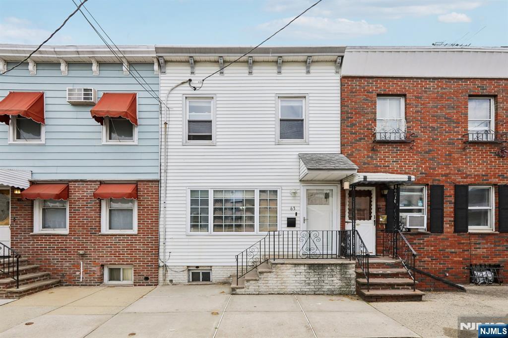 Welcome to 63 Garrison St Step into this charming and well-maintained home, ideally located in the highly sought-after Ironbound section of Newark. Offering convenient access to major highways, public transportation, Downtown Newark, and a quick commute to New York City, the first level features a spacious open-concept layout designed for comfortable living and entertaining. The modern kitchen offers granite countertops, ample cabinetry, and a door leading to the amazing backyard. The inviting living and dining areas provide the perfect space for gatherings, along with a full bathroom for added convenience. The upper level offers three comfortable bedrooms. A finished basement provides additional living space, perfect for a recreation room, home office, gym, or guest area. Enjoy outdoor living with a large backyard. Conveniently located near local restaurants, shopping, parks, and Newark Penn Station, this home combines comfort, location, and value. Don't miss this opportunity to own a wonderful home in one of Newark's most desirable neighborhoods.