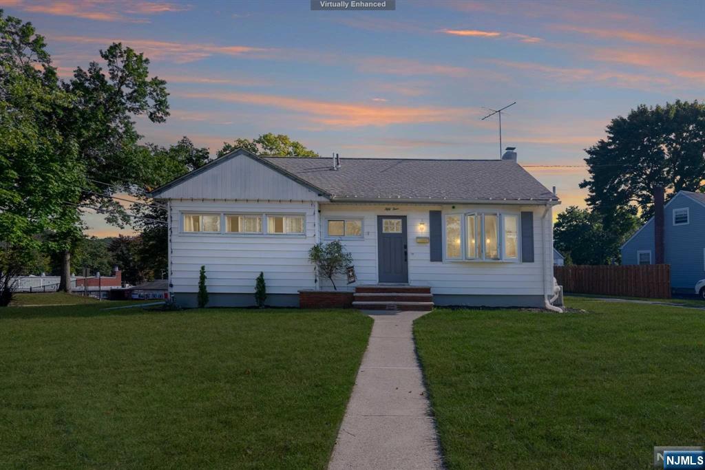 Welcome to 54 Pequannock, a stunning 3-bedroom, 1.5-bath ranch located in the heart of Pompton Lakes. Renovated in 2018, this home seamlessly blends modern style with timeless comfort. Step into the bright, open-concept living room, featuring large bay windows and gleaming hardwood floors throughout. The spacious kitchen boasts quartz countertops, a classic white subway tile backsplash, custom white cabinetry, and a full Whirlpool stainless steel appliance package, including a gas stove and double-door refrigerator. With LED recessed lighting and central heating/cooling, comfort is ensured year-round. The partially finished basement offers a full bath and endless possibilities for a recreation room, home office, or play area, with the convenience of a dedicated laundry space. Enjoy your mornings on the cozy enclosed porch, perfect for relaxing or growing houseplants. Outside, a detached garage provides ample parking and storage. This home truly is a dream come true! No Flood Zone.
