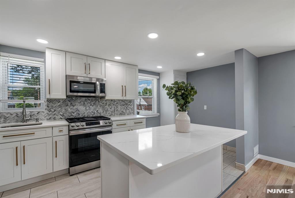 Look no further. This beautifully renovated 2-bedroom, 1-bath second-floor unit exudes modern elegance and comfort. As you step inside, you'll be greeted by brand new hardwood floors that flow seamlessly throughout the space. The heart of the home, a stunning new kitchen, boasts luxurious quartz countertops, a spacious center island perfect for meal prep or casual dining, and sleek cabinetry that provides ample storage. The updated bathroom features contemporary finishes, ensuring a relaxing retreat. Situated in a prime location, this unit offers the convenience of being close to public transportation and vibrant downtown shops, making it perfect for both commuting and leisure. Don't miss the opportunity to make this exquisite rental property your new home!
