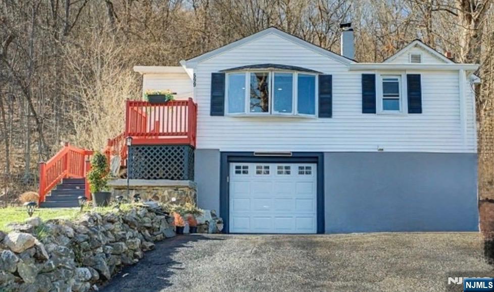 Welcome to the edge of scenic Morris County parkland, where this charming 7-room ranch offers a peaceful setting surrounded by nature while still providing convenient access to commuter Routes 15 and 80. The home welcomes you with a bright, south-facing foyer filled with windowsâ€”an ideal sunlit space for plant lovers or a relaxing sitting area. The foyer flows into a spacious living and dining room combination featuring hardwood floors, creating an inviting layout suited for both everyday living and entertaining. The primary bedroom includes a large walk-in closet, and multiple closets throughout the home provide excellent storage options. The recently updated eat-in kitchen serves as the heart of the home, showcasing granite countertops, 42-inch cabinetry, and stainless steel appliances. Just off the kitchen, the family room offers a warm and comfortable gathering space highlighted by a vaulted ceiling and a wood-burning fireplace. A versatile bonus room with a closet provides flexible space for a home office, den, or guest room. Downstairs, the basement features a wood-burning stove that can serve as an alternative whole-house heating source. Heat source is from an inside above-ground oil tank. Step outside to enjoy the patio and terraced backyard, where mature landscaping creates a beautiful setting that will come alive with color throughout the seasons. Highest and Best June 8th.