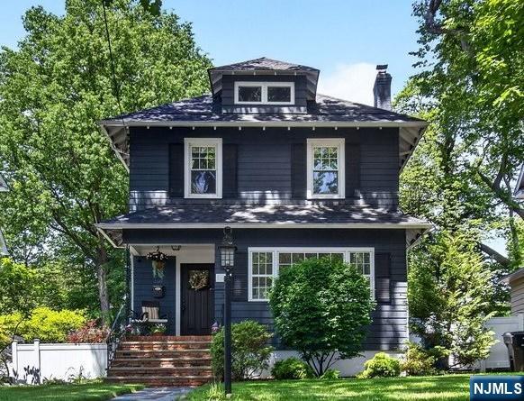 Located in a highly desirable neighborhood, this classic Colonial boasts charm and modern updates. Must see in person to appreciate the timeless hardwood floors, 9' ceilings, and abundance of natural light. A thoughtfully designed two-story addition includes a spacious family room and an impressive primary suite complete with a walk-in closet and an ensuite full bathroom. Additional highlights include generous-sized bedrooms, ample closet space, a convenient 2nd floor laundry room, 2 home office spaces perfect for remote work, and a finished basement. Central air conditioning ensures year-round comfort. Plenty of storage space in the basement and 3rd floor. Step outside to enjoy the outdoor patio with a built-in kitchen and flatscreen TV, ideal for entertaining. Conveniently park in rear of home accessed via private alleyway on Montross Ave. or Carmita Ave. where you will find a 2-car garage and an EV charger. This home offers the best of suburban living with exceptional convenience. Located directly across from a top-rated elementary school in one of the area's most sought-after school districts, the property also enjoys easy walkability to Rutherford's vibrant downtown filled with charming shops, restaurants, and cafes. Commuters will appreciate the seamless access to NYC via nearby bus and train transportation. Don't miss the opportunity to make this home yours and experience all that Rutherford has to offer!