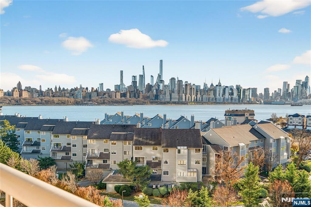 Luxury waterfront living at the Gold Coast's premier residence "The Watermark". Spectacular 3 BR, 3 FBTH condo boasting breathtaking views of the NYC skyline from living area, master bedroom terrace and bedrooms. Exquisite gourmet kitchen w/open flow to dining and living area w/gas fireplace. Beautiful wood floors thru-out. Elegant marble baths. Second bedroom w/ensuite bath and walk-in closet. Rare 3 bedroom unit situated north to south in complex to display incredible south east and north east views! Two indoor parking spaces included. Enjoy a luxurious lifestyle with every amenity: indoor/outdoor pools, golf simulator, billiards, theater, fitness center, guest suites, concierge. Transportation to ferry, light rail, buses at doorstep. Must See!