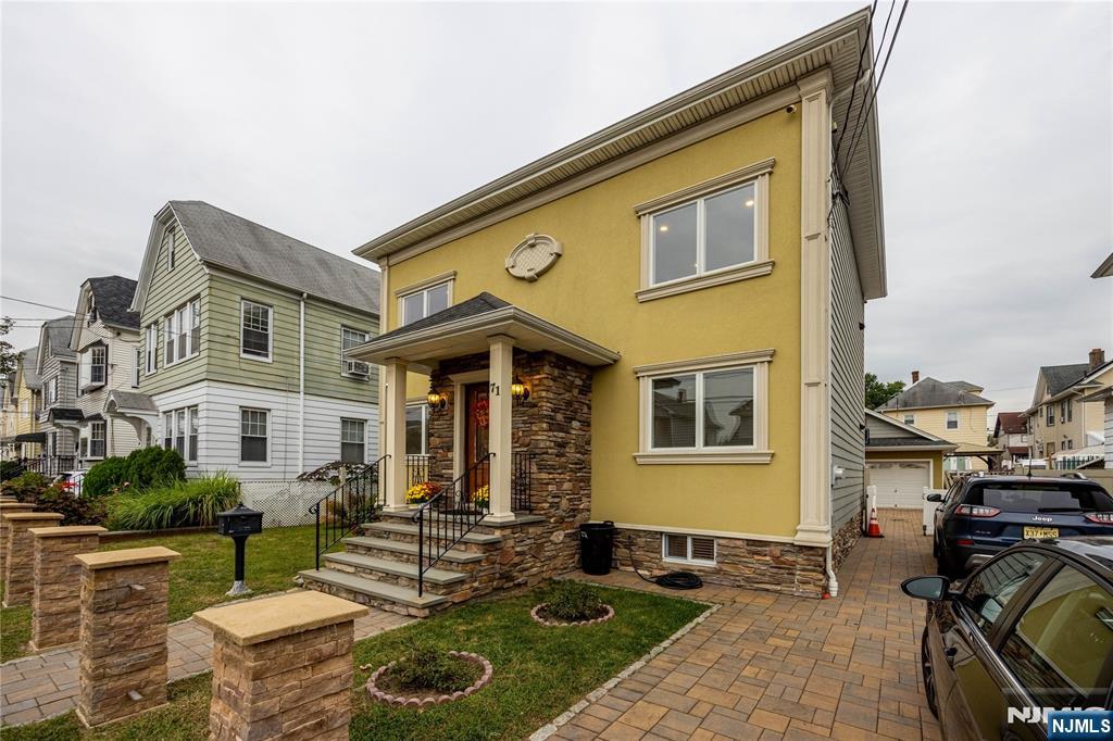 Welcome to this BEAUTIFULLY maintained Two-Unit home in a prime Clifton location, just minutes from New York City and perfectly situated for an easy commute. Whether you're looking for a SMART INVESTMENT or a home with room for guests, 71 Christie Ave offers INCREDIBLE space, comfort, and convenience. The first-floor unit features 2 bedrooms, a full bath, a bright living room, and an eat-in kitchen, with direct access to the finished basement. The lower level includes a recreational room, mini kitchenette / coffee bar area, office, laundry area, storage, and half bath ideal for working from home, hosting guests, or creating additional living space. The second-floor unit mirrors the same inviting layout with 2 bedrooms, full bath, living room, and kitchen, plus walk-up access to a large unfinished attic with excellent potential. Outside, enjoy a fenced-in backyard, private patio with custom built Pergola, and a 2-car garage with heating. Thoughtfully built with quality craftsmanship, this home is truly move-in ready. Its combination of flexible living spaces, modern comforts, and a location that keeps the New York City within easy reach makes this property a rare opportunity in Clifton.