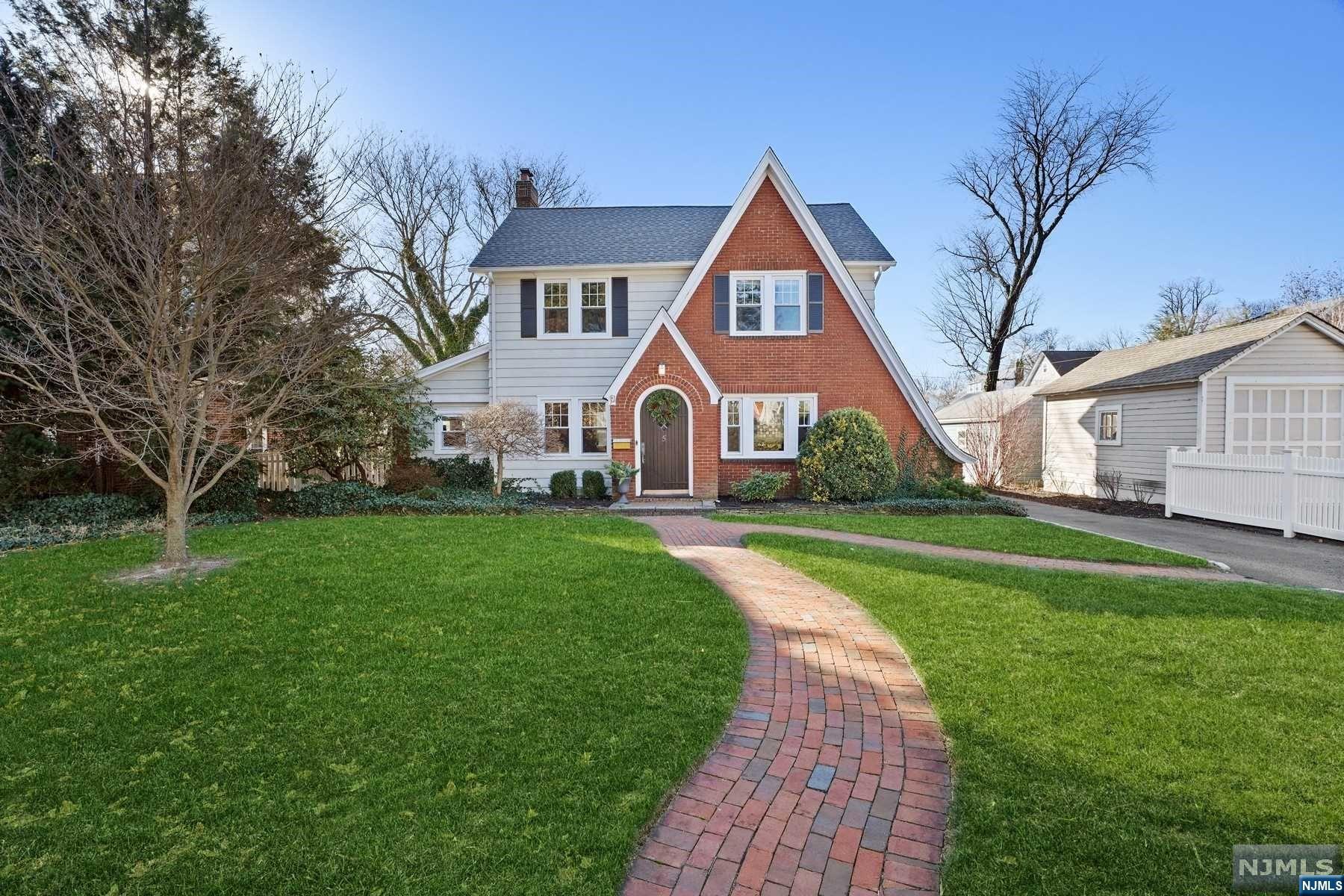 Welcome to this stunning & updated Colonial located on a quiet street on almost a quarter acre of land! The 1st fl. includes a charming entrance vestibule, light-filled living rm w/WBFP & recessed lighting, formal dining room, updated kitchen w/center island, farm sink, new refrigerator & gas range, powder room, & den currently used as a home gym. Upstairs features a primary bedroom, 2 additional bedrooms & an updated bathroom on 2nd fl. & unfinished attic space on the 3rd fl. with lots of expansion potential. Lower level includes a finished family room plus home office space, updated full bathroom, laundry room, & plenty of storage. The fully fenced level backyard features two brick patios great for entertaining & 2-car garage. So much more to love about 5 Euclid Pl - C/A, new roof, new furnace, new hot water heater, new washer & dryer, new custom closet in primary bedroom. NYC bus on the corner, less than a mile to the Walnut St & Watchung Plaza villages & train stations.