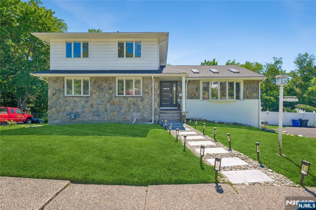Impressive 5-bed, 3-bath split level offering over 3,600 sq ft of beautifully finished living space in the heart of Emerson, one of Bergen County's most desirable and sought-after communities. Main and upper levels offer 2,253 sq ft of thoughtfully designed living space with an open, flowing layout, spacious chef's kitchen, large center island, and whole-house water purification system. Brand new roof, new deck, and central HVAC throughout all the big ticket items are already done, giving you true move-in confidence and peace of mind for years to come. Note: second floor does not have a bathroom on that level. Three full baths are distributed across the other levels making this an excellent opportunity for the right buyer to add a personal touch and build instant equity in one of Bergen County's strongest real estate markets. The fully finished basement adds an impressive 1,381 sq ft of versatile living space ideal for a media room, playroom, home office, or in-law suite. The converted garage currently serves as a private home gym with all equipment easily removable, offering endless possibilities for additional living space, storage, or recreation. Located in the top-rated Emerson School District, served by Northern Valley Regional High School, consistently ranked among Bergen County's finest schools, with convenient access to shopping, dining, parks, and an easy commute to New York City. Schedule your private showing today.