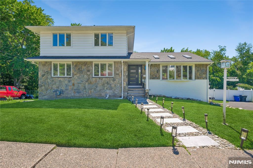 Impressive 5-bed, 3-bath split level offering over 3,600 sq ft of beautifully finished living space in the heart of Emerson, one of Bergen County's most desirable and sought-after communities. Main and upper levels offer 2,253 sq ft of thoughtfully designed living space with an open, flowing layout, spacious chef's kitchen, large center island, and whole-house water purification system. Brand new roof, new deck, and central HVAC throughout all the big ticket items are already done, giving you true move-in confidence and peace of mind for years to come. Note: second floor does not have a bathroom on that level. Three full baths are distributed across the other levels making this an excellent opportunity for the right buyer to add a personal touch and build instant equity in one of Bergen County's strongest real estate markets. The fully finished basement adds an impressive 1,381 sq ft of versatile living space ideal for a media room, playroom, home office, or in-law suite. The converted garage currently serves as a private home gym with all equipment easily removable, offering endless possibilities for additional living space, storage, or recreation. Located in the top-rated Emerson School District, served by Northern Valley Regional High School, consistently ranked among Bergen County's finest schools, with convenient access to shopping, dining, parks, and an easy commute to New York City. Schedule your private showing today.