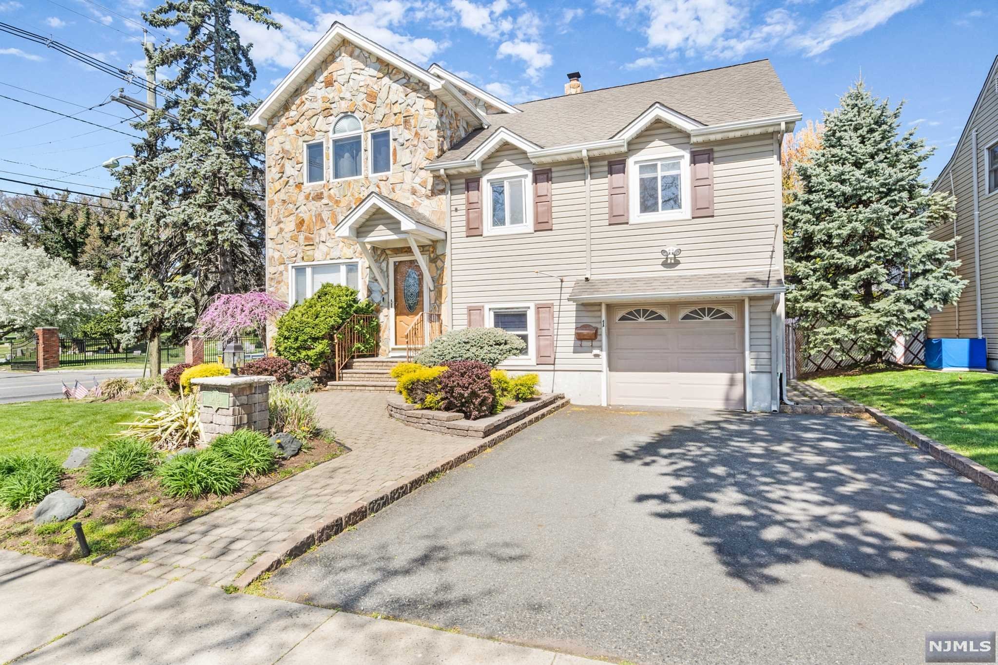 Beautifully landscaped home with tons of curb appeal! Interior has been recently renovated for an open floor plan on the first floor. Modern kitchen with island, quartz countertops and black stainless steel appliances. All appliances are 1.5 years old. Massive prime bedroom suite upstairs. The backyard has a trex deck and in-ground pool.