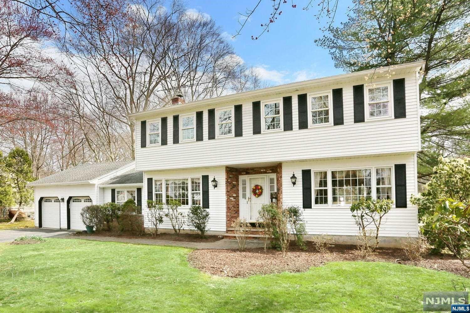 Step into this picturesque,Center-Hall Colonial, nestled in a serene suburban setting, close to NYC by car,bus or train!Lrge DRm &LRm w/HWFLs.Bright EIK overlooks tranquil yard. Retreat to the sunken den w/Gas Fpl,ideal for intimate gatherings or quiet evenings at home.Keep your home organized w/a dedicated Mudroom, perfect for storing outdoor gear. Tremendous Primary Bdrm w/Updated Ensuite Bath &Luxurious WIC. With 3 Add'l Bdrms, there's plenty of space for family&guests to relax.The Basement features Home Office plus Rec Room& Storage.Step outside to the expansive, New,"TREX" deck, where you can bask in the beauty of nature. Enjoy panoramic views of the Sprawling Private Property& scenic river.Park w/ease in the 2Car gar, providing ample space for cars& storage.Benefit from Inground Sprinklers,Shed, Cent Vac,&Home Security System.Top Schools! Don't miss the opportunity to own this exceptional home,offering a perfect blend of a classic floorplan, modern amenities& natural beauty!