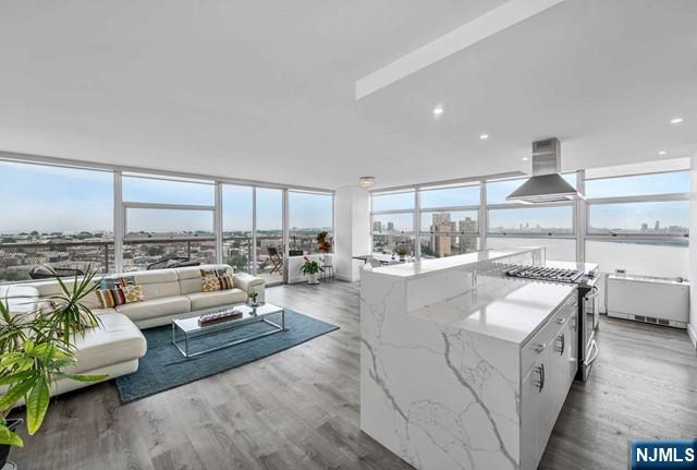 Two bedrooms Penthouse at Tower West offers it all! Over 1400 sqft with large living / dining area, open concept kitchen, 2 bedrooms & 2baths, fully renovated. Rent includes ALL utilities -Electric, hot water, heating and cooling are included in the rent! Building features a full time doorman, small gym, outdoor pool & deck. Parking is included!.Located on Boulevard East with easy access to NYC via bus or Ferry, close to all restaurants and shopping!