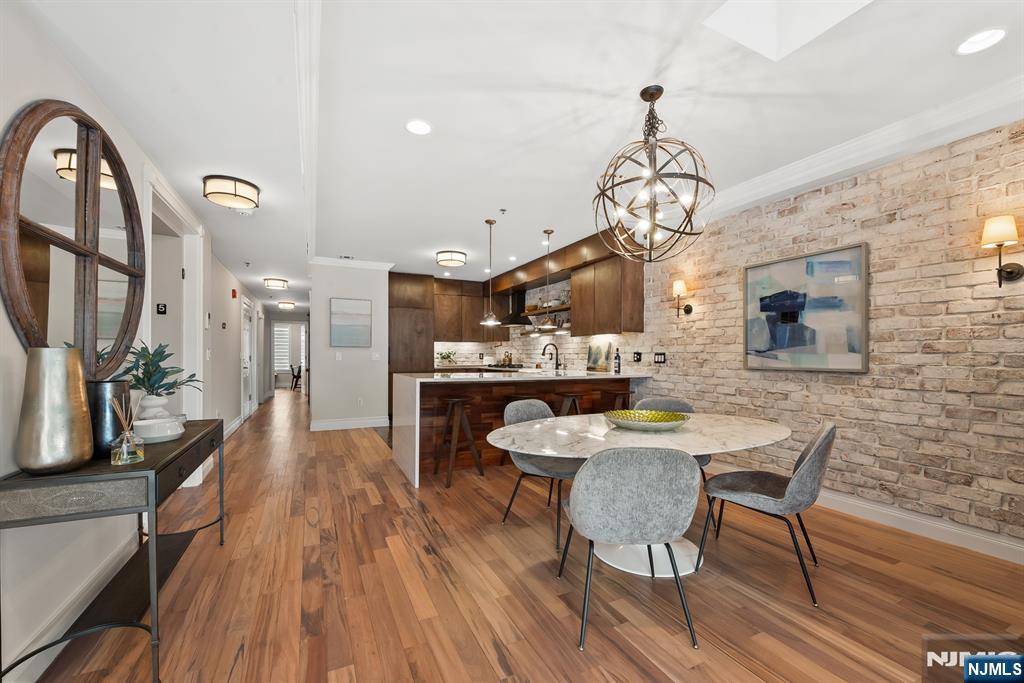Welcome to this one-of-a-kind sprawling 5BD/4BA duplex in the heart of Hoboken. Boasting over 3,000 sq ft of flexible living space and three outdoor areas , including a full-size rooftop deck with spectacular NYC views, this home truly has it all.Take the private elevator to the top floor and step into a bright, open floor plan with a massive kitchen, dining area, and living room. The kitchen features high-end appliances, abundant cabinetry, generous counter space, and a pantry. The dining room easily hosts large gatherings, while the living room opens to a terrace perfect for entertaining or relaxing. Also on this floor are a large bedroom with en suite bath and a second bedroom with a Murphy bed as well as a full bath.The lower level, also accessible by elevator or a beautiful architectural staircase, offers a second living room, currently set up with a full-size pool table and lounge seating, a versatile den that can serve as a bedroom, home office, or gym. Completing the floor are a full-size laundry room, a bedroom with en suite bath, and an additional bedroom and full bath.With expansive indoor and multiple outdoor living spaces in a prime Hoboken location, this duplex delivers the ultimate combination of luxury, comfort, and flexibility. Conveniently located near transportation to NYC, Church Square Park, coffee shops and coveted Hoboken hot spots, Flour, Dozzinoâ€™s, The Little Local and the famous Fioreâ€™s deli. Parking available nearby for an additional fee.