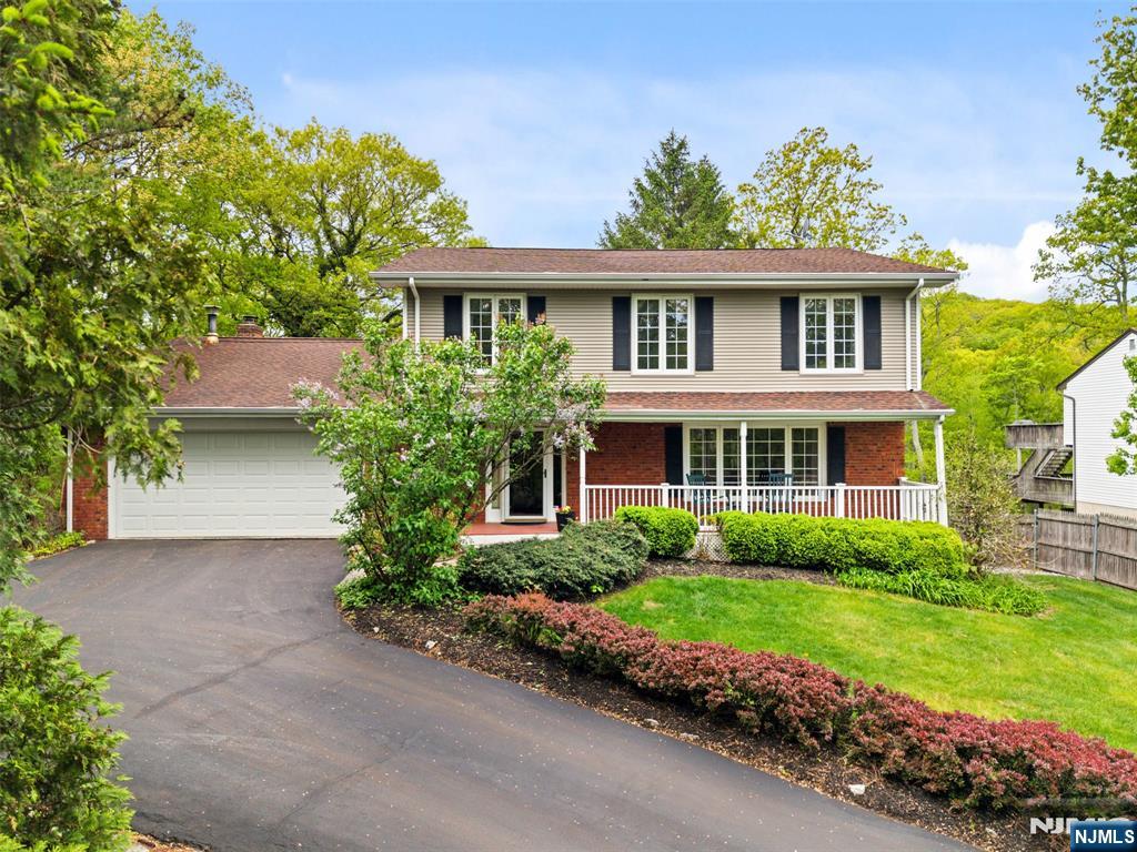 Set in the Stonetown section, within the Lake Riconda community, we welcome you to this beautiful 4 bedroom, 2.5 bath colonial set on nearly three quarters of an acre in one of Ringwoodâ€™s most peaceful and picturesque lake communities. This home blends privacy, nature, and comfort in a setting that feels like a year-round retreat. The main level offers a warm, inviting flow with an entry foyer, living room, formal dining room, and updated eat in kitchen with granite countertops and stainless steel appliances and a half bath. The family room features a wood burning fireplace, cathedral ceiling, skylights, creating an airy, sun filled gathering space. Just off the kitchen is the standout four season atrium, showcasing floor to ceiling windows - the perfect spot to relax and take in the natural surroundings. Upstairs, the primary bedroom includes a private bath in addition to three additional bedrooms, a full bath, and a separate loft area that can be used as an office, or whatever suits your needs. The finished walkout basement adds even more flexibility, ideal for recreation, hobbies, or extended living space. Outside, a huge two-level deck offers exceptional room for entertaining, with peaceful and elevated views of the wooded landscape. A lemonade porch overlooking Riconda Lake further enhances the homeâ€™s outdoor appeal. With nearby hiking trails, state land, and abundant outdoor recreation, this is a nature loverâ€™s paradise. YOU WILL LOVE LIVING HERE!