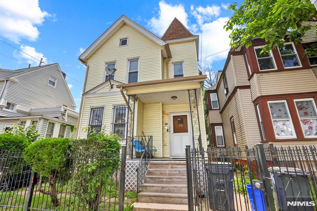 Exceptional investment and owner-occupant opportunity in the heart of Newark! This spacious two-unit home offers the added bonus of a finished third-floor living area, providing endless possibilities for extended living, a home office, or recreation space. Perfectly positioned neighboring the renowned Donald M. Payne Sr. School of Technology and just moments from Essex County College, this location is ideal for commuters and city living alike. Enjoy easy access to NJ Transit trains and buses, as well as Routes 280, the Garden State Parkway, and the New Jersey Turnpike, making travel throughout New Jersey and New York City a breeze. The property features a fenced backyard and deck, perfect for entertaining or relaxing outdoors. The first-floor unit offers a full soaking tub and a walk-out kitchen leading directly to the deck, ready for your personal updates and design ideas. With ample living space, convenient transportation options, and incredible potential, this property is a rare opportunity in one of Newark's most accessible locations. A true commuter's dream! The Donald M. Payne Sr. School of Technology and nearby Essex County College contribute to the strong educational appeal of this location. Located in the North Newark and minutes away from Penn Station. Call for access must speak with LA before accessing the home Property is being sold in an AS IS Condition Buyer is responsible for all certificates required to close municipal or otherwise