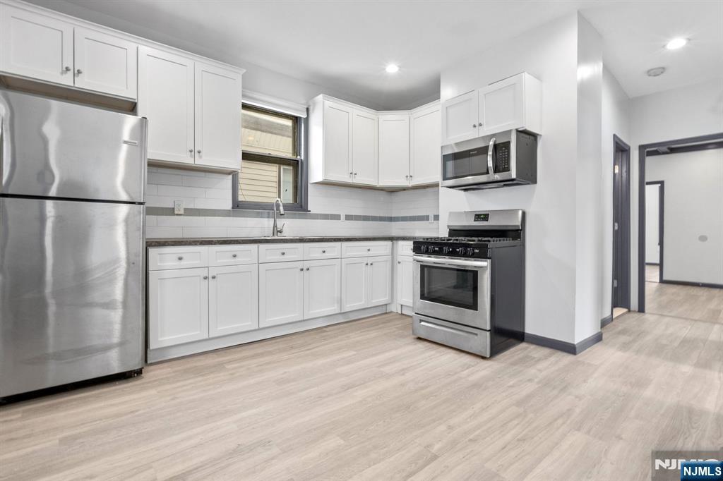 An opportunity like none other! 211 is a legal 3-family showcasing two fully renovated (3) bedroom units [one slightly bigger than the other] and one studio apartment on the top floor, also fully renovated. This property features plenty of updated features, a full basement with potential for buildout, and a sizeable backyard with a garage that can be used for storage. This beauty is located right near major highways and public transportation. Unit 2 & 3 Delivered Vacant, Unit 1 can be as well. Book a tour, make it yours!