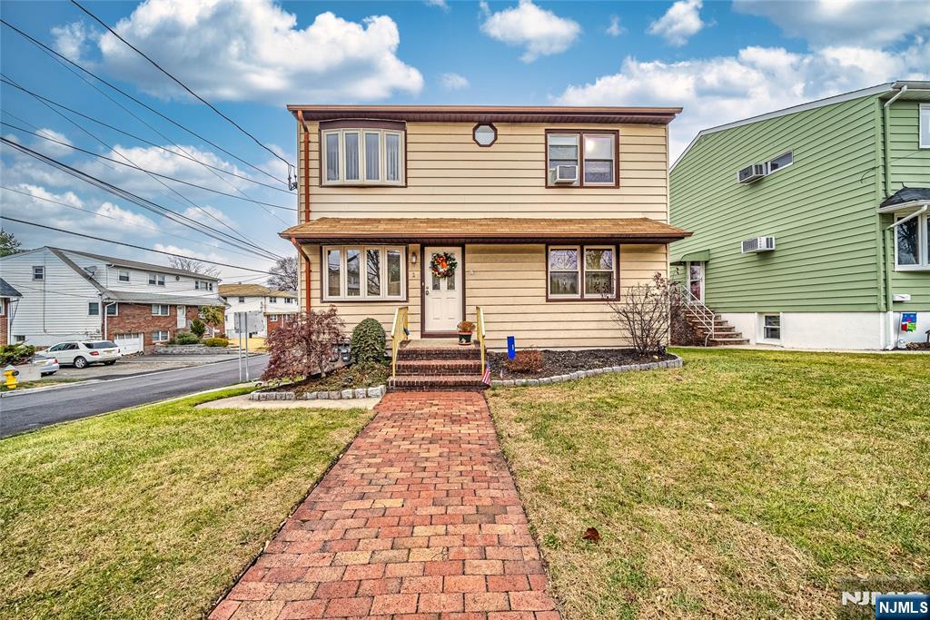 A very rare find for sure!!! Location! Location! Location!! The first floor unit is comprised of the three bedrooms, full bath, living room kitchen and in the basement there is a family room with a small kitchen, laundry room and second bath. The second floor unit is the same floor plan as the first floor, three beds, one full bath and a living room. From the basement you can enter the one car garage.The side yard is large and it is fenced in, another rare find. The house features a central vacuum system in the first floor unit.