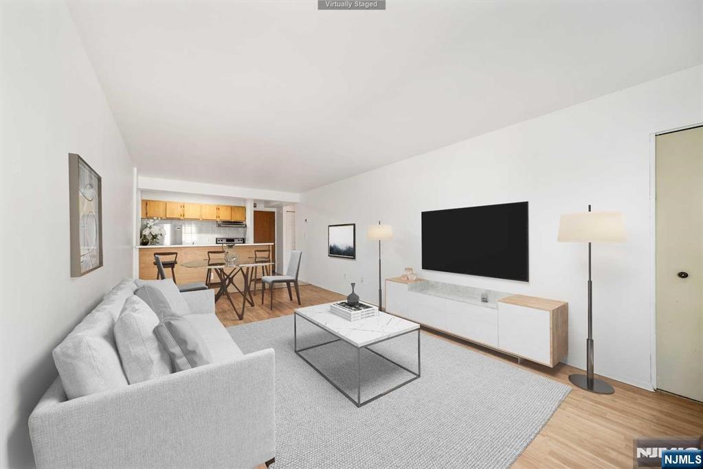 Introducing a newly renovated, serene one-bedroom apartment located in the center of Palisades Park. This bright and airy unit boasts an inviting open floor plan, featuring a brand new kitchen w/quartz countertops, new recess lights, hardwood flooring throughout, an energy-efficient hot water baseboard heating system, a modernized bathroom, and a spacious living area with generous closet space. Facing the other side of Grand Ave, with an open view, this unit offers both privacy and tranquility. Its prime location provides convenient access to major highways and bus routes, ensuring an effortless commute to NYC. Enjoy the vibrant local community with nearby attractions such as King Spa, Overpeck Park, a variety of supermarkets, and an array of diverse dining options and cafes. Additionally, include a reserved parking spot, with water included in the rental. Schedule your viewing today! Note: No pets are permitted in the building. Move in Fee- $150,refundable $500 move in deposit