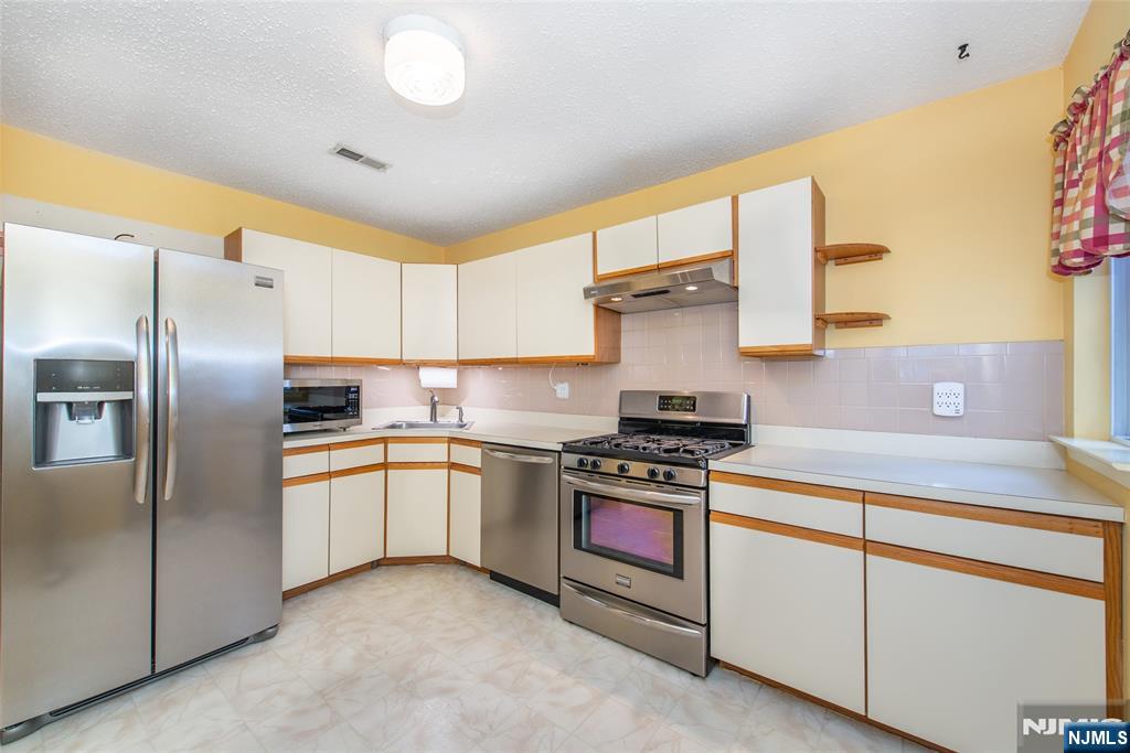 Welcome home to this lovingly maintained 2-bedroom, 1.5-bath townhome in the heart of the Succasunna section of Roxbury! This two-level townhome offers comfortable living with a bright, open layout, cozy gas fireplace, and a large deck for relaxing or entertaining. The main level inlcudes a large living room with a gas fireplace, dining room, kitchen and a half bath - this level has access to the large deck through 2 Anderson sliders! 2 Large bedrooms with ample closet space and a full bath complete the upper level. Enjoy the convenience of a 1-car garage, in-unit, full sized, newer laundry, and newer SS appliances. With just a few updates, you can make this your dream home! Ideally located near shopping, dining, parks, and major highways, plus just minutes from beautiful Horseshoe Lake a community favorite for year-round activities. Roxbury is known for its award-winning schools, top-ranked sports programs, nationally recognized marching band, and innovative robotics and aerospace programs. Experience the true sense of community that makes Roxbury such a wonderful place to call home. Best-priced unit in the development move right in and start making memories! Community has a pool, playground and basketball court. Central Air! Natural Gas! Public Utilities! Low Taxes! Quick Closing Possible.