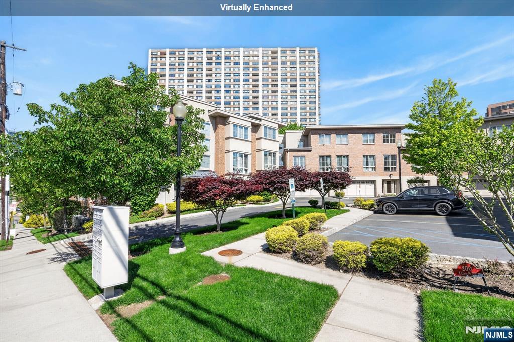Tucked into the Hudson Palisades cliffs right on the Edgewater and Cliffside Park border, this private three-floor townhouse is something you rarely come across on the Gold Coast, a place that actually feels like home. No shared lobbies. No shared stairwells. Just your own front door, your own space, and three full floors to call yours. At 1,720 square feet with 2 bedrooms and 2.5 baths, the layout flows beautifully. The East facade catches seasonal Manhattan skyline views, and when the leaves drop in fall and winter, both private balconies open up to sweeping Hudson River and Manhattan view that will genuinely stop you in your tracks. In the warmer months, balconies are wrapped in the lush natural canopy of the Gorge Rd Hill, shaded, private, and peaceful in a way that feels worlds away from the city just 30 minutes down the road. One thing buyers in this market always ask about is flood insurance. You won't need it here. That alone saves most buyers, over time, compared to waterfront properties. The monthly cost of owning this home is meaningfully lower than what you'd pay for something comparable in Edgewater. The location checks every box: a quiet cul-de-sac street, two NJ Transit bus stops right outside, and the GWB just minutes away for drivers. Mitsuwa, Trader Joe's, Whole Foods, and Sojo Spa are all close by. The home is vacant and ready to go, walk in, and make it yours. Property offered in as-is condition. Seller is a licensed New Jersey Real Estate Broker.