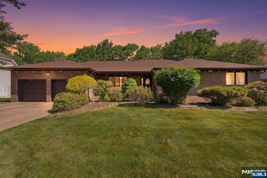 This desirable North Edison expanded ranch features 3 bedrooms, 2 bathrooms, and nearly 2,500 square feet of single-level living space, all situated on a generous 0.4-acre lot. Highlighted by approximately $80,000 in premium upgrades over the last four years, the home boasts a new roof (2022), a new privacy fence (2023), brand-new Andersen windows (2024), and an Andersen sliding door (2025). Inside, a welcoming foyer flows seamlessly into a formal living room and a sprawling family great roomâ€”both featuring recessed lighting and sliding doors that open to a deck and patio overlooking the private backyard. The heart of the home is the eat-in kitchen, complete with a breakfast nook, stainless steel appliances, and granite countertops. Slide the pocket doors open to reveal an elegant formal dining room, perfect for hosting. The oversized primary suite serves as a true retreat, boasting dual walk-in closets and an updated en-suite bathroom with a marble double-sink vanity. Additional features include beautiful hardwood flooring throughout, central AC, dual-zone baseboard heating, an attached two-car garage, and a massive, full-length unfinished basement presenting endless potential for customization. This home perfectly blends peaceful, suburban living with unparalleled convenience, offering easy access to NYC train stations, bus stops, major commuter routes, premier shopping, dining, and local hospitals.