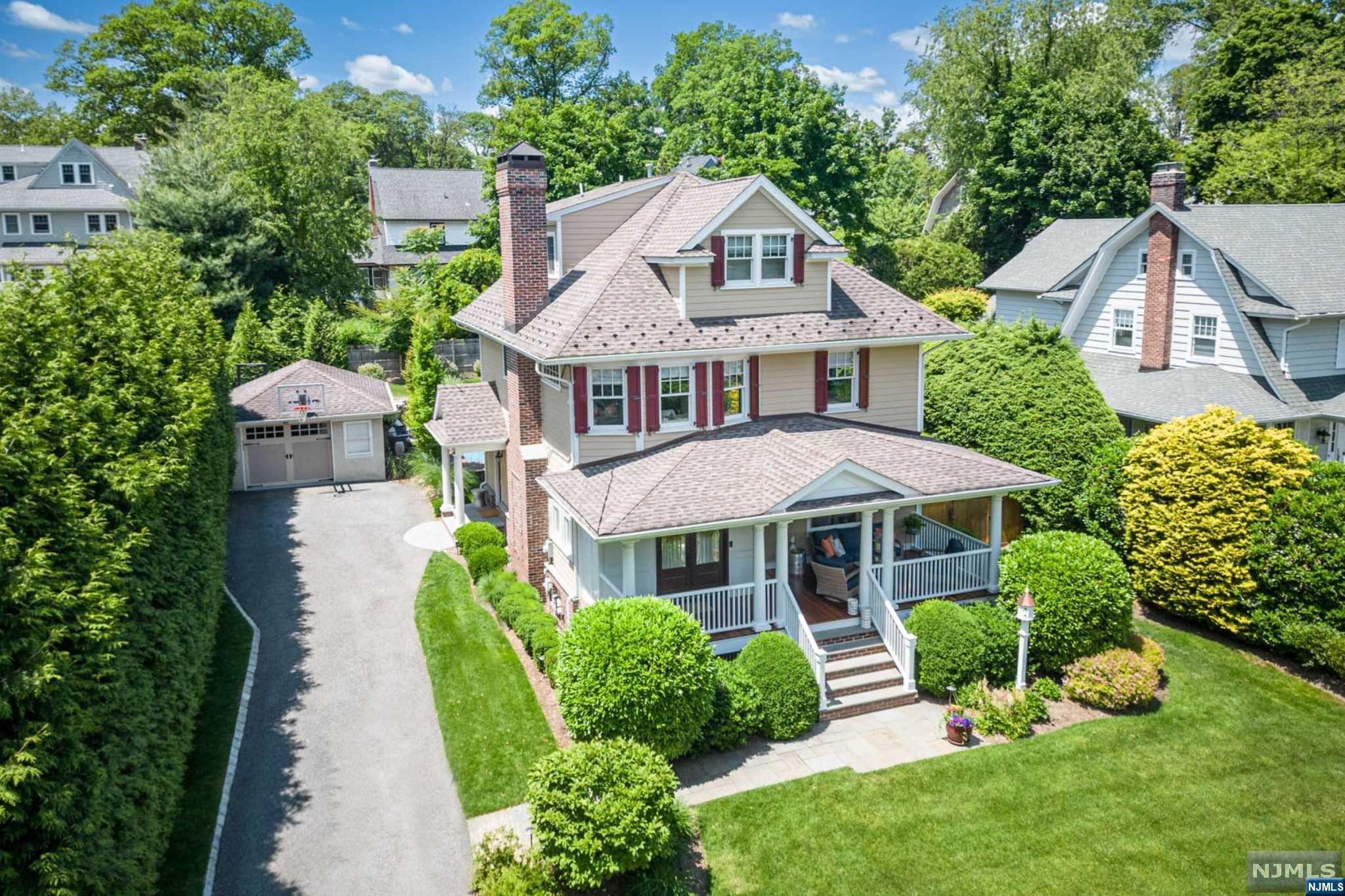 PRISTINE COLONIAL RENOVATED FROM TOP-TO-BOTTOM IN 2016! Prepare for the best of modern comfort and convenience with all new: hardie board siding, roof, electric, plumbing, multi-zone HVAC/heating, central vac, bathrooms, kitchen, moldings & more. Indoor-outdoor relaxation & entertainment will be yours, as this move-in-ready home offers a backyard oasis complete with a pool, deck for outdoor dining and large covered front porch that invites you to the immaculately finished interior. Open layout highlighted by a living room with fireplace & gleaming hardwood floors flowing into the oversized dining room. Magazine-worthy designer eat-in kitchen equipped with top-of-the-line appliances, including a Wolf oven, seamlessly connects to outdoors & mudroom. Four bedrooms, 3 full & 2 half baths total, primary suite with high ceilings, spa-like bath & a large walk-in closet, and convenient 2nd-floor laundry & built-in office area. All this and a prime location in Ridgewood's Willard district!