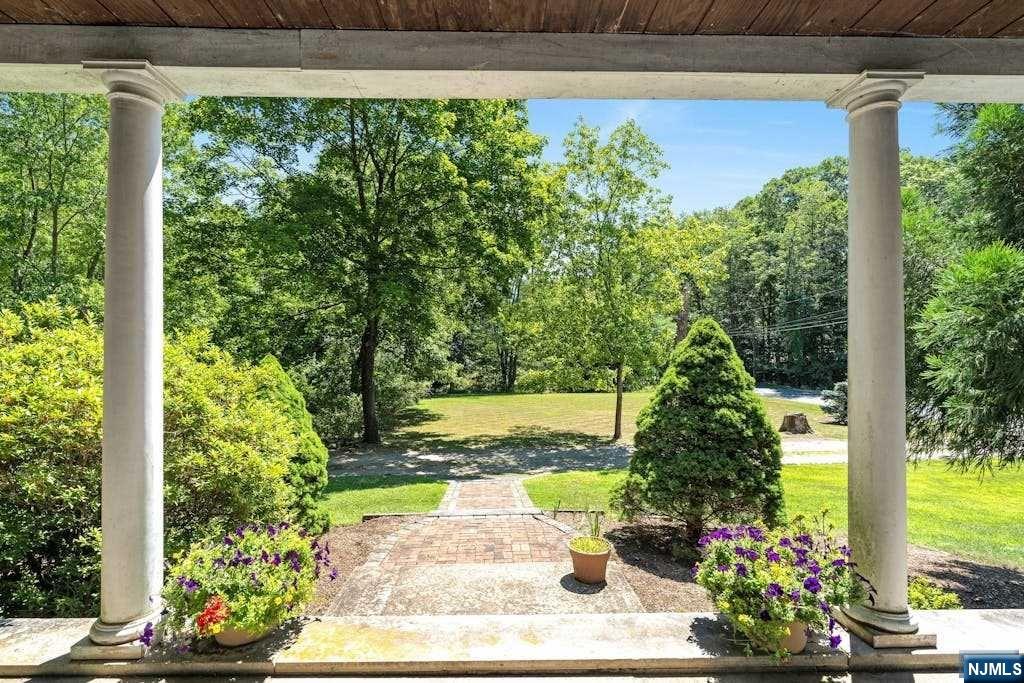 This picturesque hidden gem is a rare find! 1st time available in over 50 years! Discover your own slice of serenity in this sprawling 1.8-acre property in parklike setting with farmhouse-style colonial featuring 4 bedrooms & 2 baths. The lemonade front porch welcomes you & offers a peaceful retreat to watch the sunrise with a cup of coffee or a late day relax to soak in the quiet. Front to back living room with wood floors, dining room & full bath off hallway. Eat in kitchen with SGD to fenced in area plus 2nd door leads out to great patio space. Garage plus multiple sheds. Newer 2nd floor surprises with 4 bedrooms with wood floors & 2nd full bath. Unfinished basement. Glorious setting surrounded by lush greenery, flowering shrubs & mature trees. A must see for nature lovers seeking a tranquil retreat. House is in need of updates but wow what a special place to call home! Embrace the opportunity to customize & modernize or rebuild & renovate! Bring your ideas, bring your dreams!