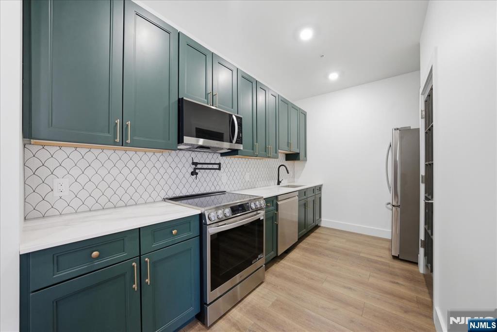 Brand-New Luxury Condo in Newark! Discover modern, move-in ready living with sleek finishes, open-concept layouts, and sun-filled spaces designed for today's lifestyle. Ideally located just minutes from Newark Liberty International Airport with easy access to NYC via the PATH train, this home offers the perfect blend of convenience and connectivity. Set in one of New Jersey's most vibrant and rapidly growing cities, this is a rare opportunity to own in a prime location where luxury meets lifestyle. Buyer incentive: Qualifies for up to $20,000 towards closing costs plus a special low interest rate making this an unbeatable value.