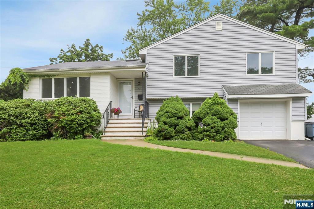 I am pleased to share a new property listing located on a quiet street within the Radburn school area of Fair Lawn. This three-bedroom, 2.5-bath split-level home features ample natural light and large windows throughout. The main level includes an entry foyer, a living room that opens to the dining room, and an extended kitchen with an island, skylights, and an eat-in area. Sliding doors from the kitchen lead to a deck overlooking a private backyard. The second floor houses the primary bedroom with an en-suite bath, plus two additional bedrooms and a full hallway bathroom. The ground level offers a family room, powder room, laundry, garage access, and sliding doors to the patio. Additionally, the finished, extended basement includes a recreation room and space for guest accommodations. The property is conveniently located near NYC transportation, parks, and houses of worship.