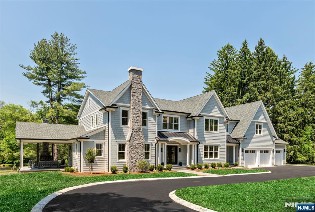Exceptional new construction offering nearly 9,000 sq ft of luxury living across 3 finished levels situated on 2.5 Acres. Designed for effortless entertaining, the home features a grand 2-story EF that flows into a banquet-sized dining room with beamed ceiling. Living room with gas FP, spectacular chefâ€™s kitchen with custom cabinetry, 10'6" island, quartz counters, butlerâ€™s pantry with wine fridge, walk-in pantry with beverage fridge, coffee station, & premium appliances. Breakfast room with sliders to rear patio, great room with FP, custom built in & access to outdoor covered living room w/ FP. First floor ensuite bedroom, mud room, & full bath with access to side yard. Upstairs, the spacious primary suite offers 2 large WICs, a lux bath with radiant heat, dual vanity & makeup station, soaking tub, and oversized shower. Two large ensuite bedrooms, two large bedrooms connected by a J&J BA, & laundry room and office complete this level. The finished lower level is a dream with a large rec room/game area, theater including projector & screen, snack bar, gym, full bath, and a full wet bar with seating and beverage center. Outdoor kitchen with Sommerset Sizzler Pro grill, outdoor speakers, & patio. Additional features include prewiring for surveillance, internet access points, & EV charger; Hardi exterior; 5â€ red oak hardwood flooring throughout; professionally landscaped grounds; 3-car garage with epoxy flooring, & 10-year new home warranty complete this exceptional offeri