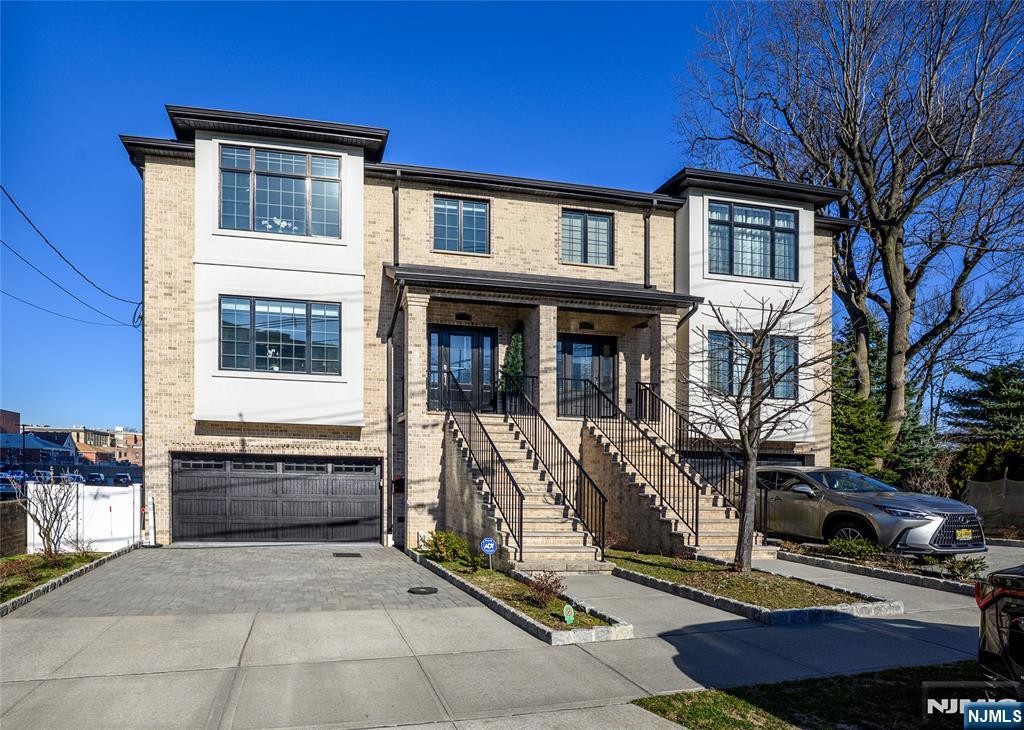 Prepare to be impressed by this luxury custom home on a massive double wide lot with customized features and commuter convenience plus over three levels of expansive open-concept floor plan that features oak hardwood floors all throughout. Ultra-modern designer kitchen beckons with custom cabinetry, gorgeous quartz countertops, premium appliances, a double sink depth in the kitchen, which further enhances your culinary experience. Beautiful light fixtures, fireplace, and another bonus sitting area with glass sliding doors that lead out to your private balcony, truly captures the perfect blend of luxury and exquisite design. Every bedroom has its own ensuite luxury designer bathroom. The primary suite features walk-in closet and a bonus guest suite complete with spa-like bath , glass design showers, double side-by-side vanities, floating soaking tub, and radiant heated floors. Enjoy your loft-style ground level suite with sixteen-foot-high ceilings, for an ultra-contemporary feel with sliding glass doors that also lead out to a private backyard. This stunning property blooms on an almost double lot with bonuses galore, such as custom automatic blinds, central vacuum, video intercom, well-designed multi-zone heating and cooling systems, washer and dryer, luxury Crown Pierre moldings, and four-car parking onsite. *Taxes are misquoted on most sites see agent for details* double wide garage great for ( ex: Escalades ,SUVS) electric vehicle charger and many more bonuses