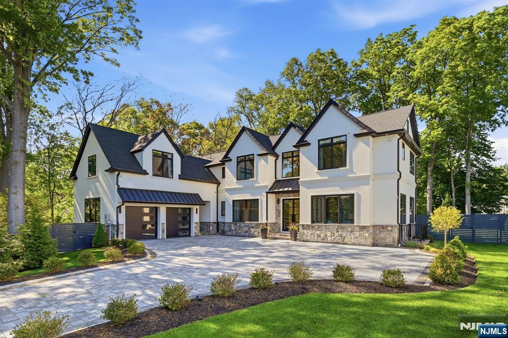 Set on a private 1/2 acre cul-de-sac in Tenaflyâ€™s coveted Knickerbocker Country Club neighborhood, this exceptional 2023 custom residence by renowned designer Ariella Horowitz offers approx. 7,100 sq ft of luxury living space w/ 6 bedrooms & 6.5 baths & attached 2 car garage.Elegant interiors feature 10', 9' & 21' ceilings, oversized windows, custom millwork, designer ceiling details & sophisticated finishes throughout.Formal living & dining rooms flow into a butlerâ€™s pantry & stunning custom chefâ€™s kitchen w/ bespoke cabinetry, marble & natural stone surfaces, high-end appliances, 36â€ paneled refrigerator & freezer, wine refrigerator & premium finishes.The open-concept layout continues into the family room overlooking the private backyard. A first-floor junior suite, walk-in pantry, powder room, & mudroom complete the main level.Upstairs, the luxurious primary suite offers vaulted ceilings, oversized custom walk-in closets, & a spa-like bath w/ soaking tub, steam shower, radiant heated floors, & dual vanities.3 additional en-suite bedrooms & laundry complete the 2nd floor.The finished lower level w/ 10' ceilings includes a recreation lounge, custom bar, fitness room, pre-wired theater, pool table area & add'l en-suite bedroom.Add'l highlights include Restoration Hardware lighting, built-in sound system, flush LED lighting, custom privacy fence, covered patio w/ built-in grill & expansive backyard. Just 30 minutes from Manhattan w/ direct express bus service to NYC.