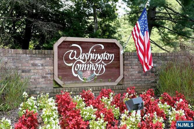 Welcome to Washington Commons. Twenty-six acres in a park-like setting. Close to shopping and transportation. Main level features a living dining room combination with engineered wood floors and sliders to enclosed brick patio. Plus an updated powder room completes the main level. Split stairs lead up to an oversized primary bedroom with updated primary bath and walk-in closet. Second level also consists of guest bedroom and bath, study and laundry room. Your unit is steps away from the Clubhouse with tennis courts and a huge swimming pool and jacuzzi. An outdoor park for afternoon reading and a children's playground is steps away. 1 car attached garage. This unit is being sold as is.