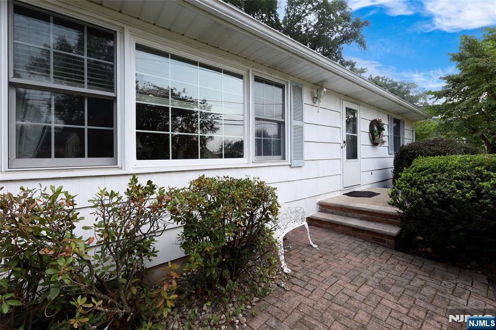 Welcome to this 3 bedroom 2-bathroom single family residence in a quiet neighborhood. offering 2200 sq ft of open and airy living space. nestled on private landscaped 0.3-acre lot, abundant natural light that fill the open concept layout. The very large bright kitchen flows into the living areas, perfect for entertaining. a cozy fireplace that creates a warm ambiance. Additional living spaces include a formal dining room, sliders out to the patio/backyard. the primary bedroom suite / bath. The first floor is complete with two additional nicely sized bedrooms, and a full bath. A finished basement provides a multipurpose versatile space for a home office, gym. NEW ROOF, close to public transportation to NYC, major highways, shopping, restaurants, schools, parks,