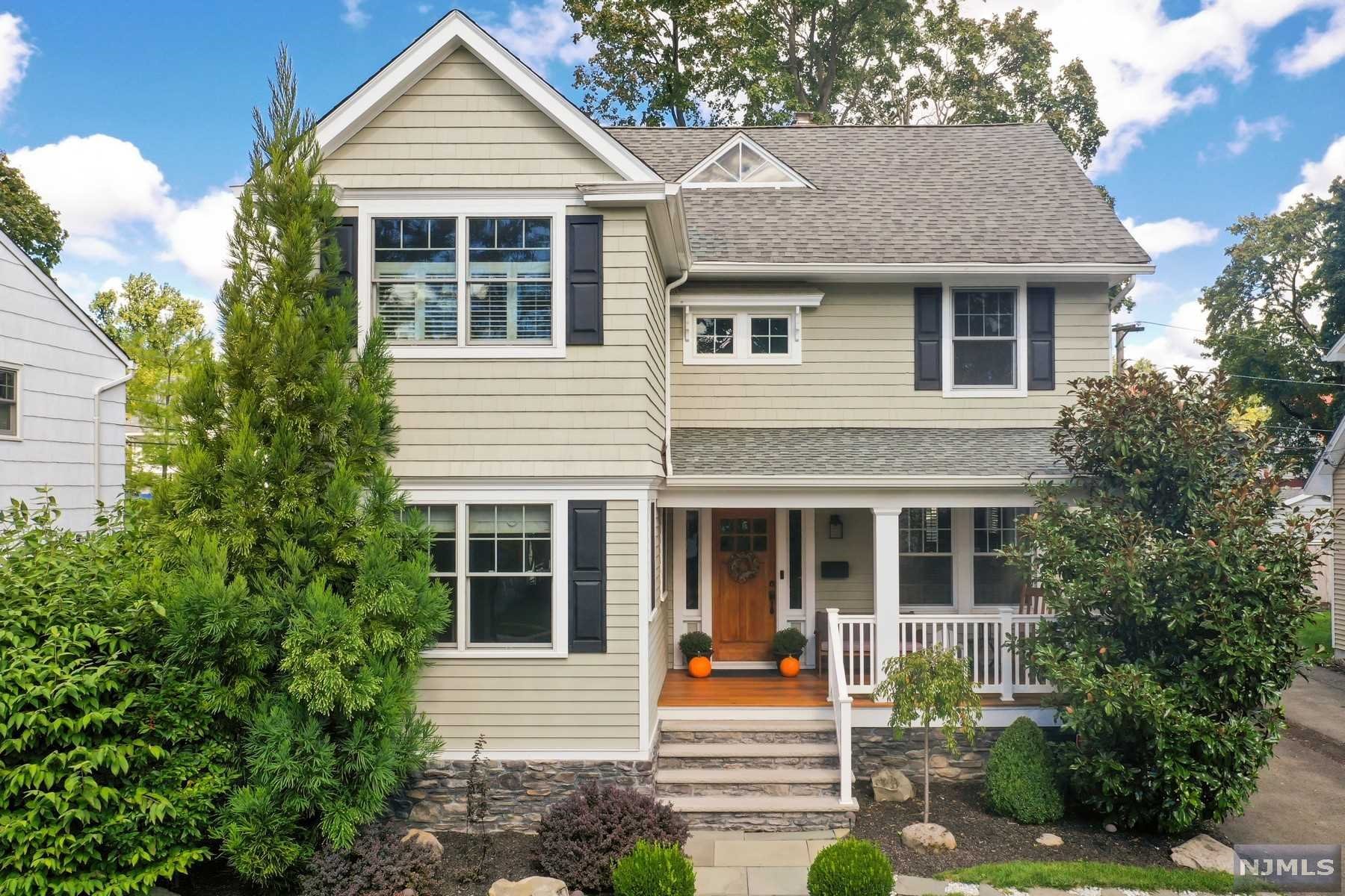 If you're looking for a turnkey home, don't miss this one! A welcoming open front porch opens to a gracious entry hall flanked by a living room with a wood-burning fireplace, sunroom, and powder room. The ideal chef's eat-in kitchen with exposed brick and breakfast bar opens to the dining room, and sliders to an expansive patio, yard, and play space are ideal for entertaining! Upstairs features a spacious primary bedroom with an incredible spa-like, en-suite bath, two bedrooms, and hall bath. Walk-up third floor presents a huge opportunity. Spacious lower level offers a family room, office, and workout space.