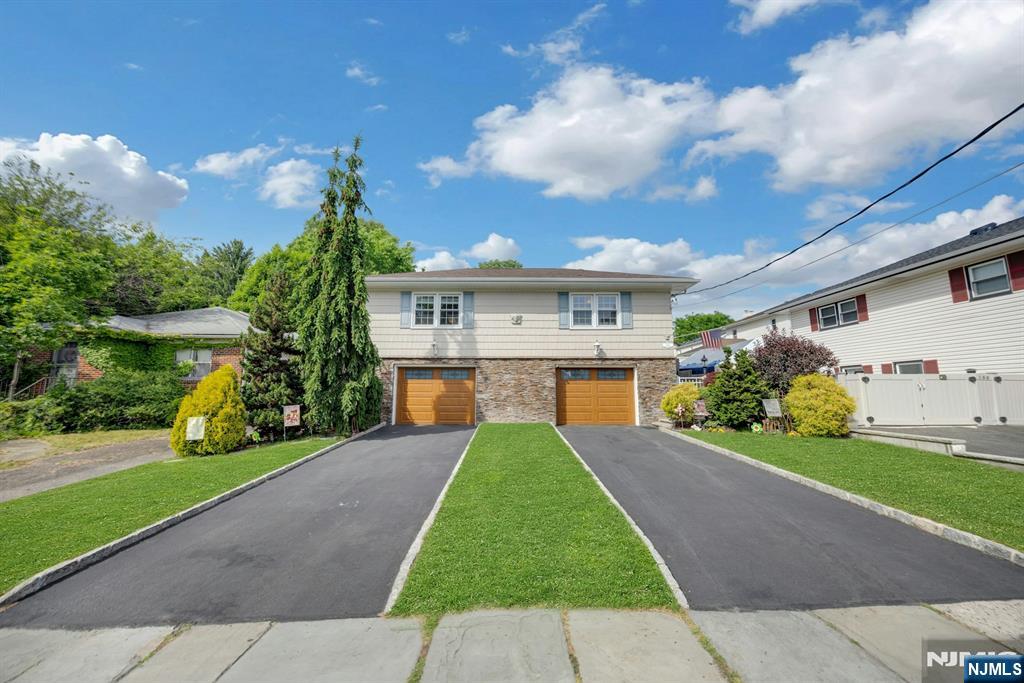 Set in the heart of Rutherford, this spacious 4-bedroom, 3-bath split-level home offers the comfort, flexibility, and location buyers have been waiting for. With multiple living areas and a thoughtful layout, the home offers flexibility for everyday living, entertaining, working from home, hosting guests, or creating a private first-floor living space.The first-floor bedroom, full bath, family room, and private entrance provide excellent versatility for guests, secondary suite use, or a separate work-from-home setup. Inside, hardwood floors, crown molding, recessed lighting, skylights, central air, and a wood-burning fireplace create a warm and inviting feel throughout. The partially finished full-size basement adds even more room for storage, recreation, or future use.Outside, enjoy a fully fenced backyard with a koi pond, plus the convenience of an attached 2-car garage. Just moments from NJ Transit bus service to NYC, Rutherford Station, Park Ave shops and dining, Felician University, and Rutherford schools, this home offers a rare combination of space, flexibility, and small-town convenience in one of Bergen County's most beloved communities.