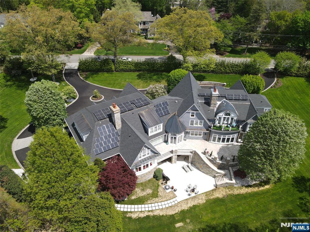 A true masterpiece in the heart of Franklin Lakes, this approx. 14,000 sq.ft. estate is situated on the most coveted street in the prestigious West Gate Urban Farms. Set on 2.5 acres of private, manicured grounds backed by protected Preserves, the setting offers unmatched serenity & seclusion. Completely reimagined over the past several years, the home blends timeless architecture w/ a fresh, sophisticated aesthetic. Every elementâ€”from the artisan millwork & custom cabinetry to the designer lighting & imported finishesâ€”has been thoughtfully selected to create an unparalleled living experience. The layout flows effortlessly, w/ expansive formal & casual spaces designed for both everyday living & grand-scale entertaining. This residence offers 7 spacious BRs and 10 beautifully appointed BAs, including a luxe primary suite with spa-like bath & custom dressing rooms & sitting room. The state-of-the-art kitchen offers top-tier appliances, oversized islands, & a seamless connection to the FR & breakfast nook. Highlights include a paneled home office, elegant dining room, multiple FPs, & soaring ceilings that bring light & volume to every room. The walk-out LL is equally impressive, offering recreational & wellness spaces, a home theater, wine cellar, gym. Outside, enjoy expansive patios, lush landscaping, & a perfect setting for a pool/spa. A rare opportunity to own a custom estate in one of Bergen Countyâ€™s most exclusive enclavesâ€”where luxury, location, & lifestyle converg