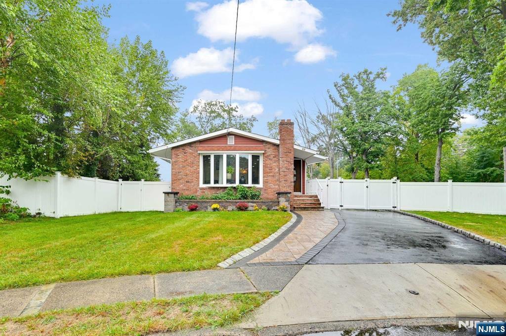 This spacious & beautifully updated 3BD, 2.5BA ranch home, perfectly situated in a peaceful cul-de-sac. Set on a meticulously landscaped lot, this home offers seamless indoor-outdoor living. Step into the inviting foyer, where you're greeted by a bright & cozy LR with large windows that flood the space w/ natural light. The updated kitchen features granite countertops, an island w/ extra storage & flows effortlessly into a spacious dining area w/ sliders to the outside patio area ideal for hosting & entertaining. The main floor includes a primary BD w/ a convenient half BA, along with 2+ BD & a well-appointed full BA. The finished basement offers even more living space, complete w/ a large rec room that's perfect for gatherings or relaxing. You'll also find a full BA, a utility/laundry room w/ generous storage. The serene backyard, which boasts a large paved patio is perfect for outdoor dining or simply enjoying the peaceful surroundings. Home comes w/ an EV charging outlet.